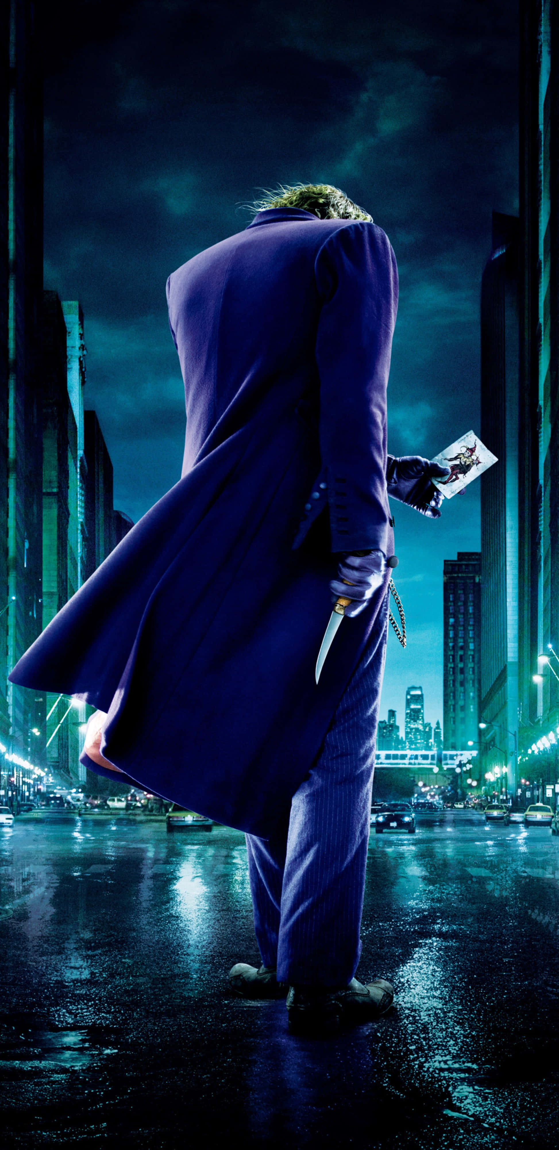 Joker, purple suit, rain-slicked city street, 4K Phone Wallpaper