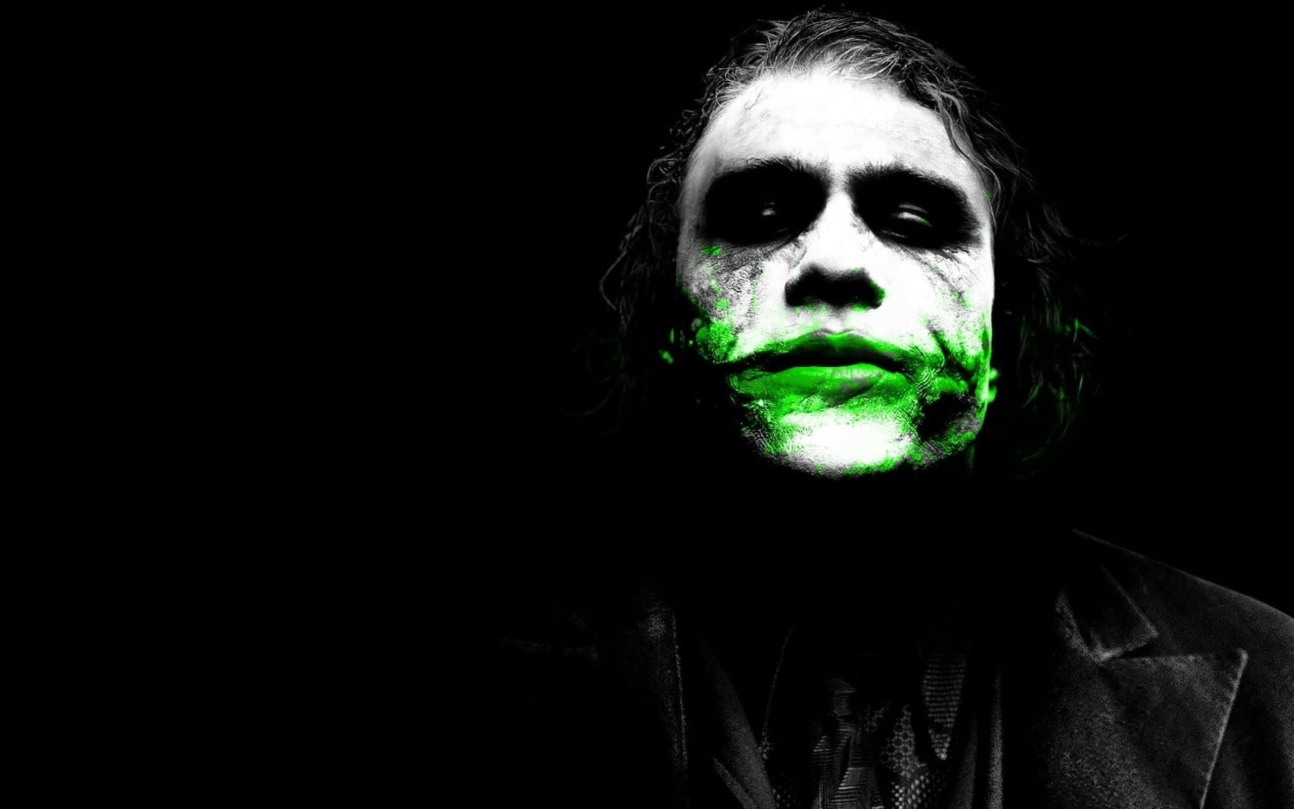 Joker, glowing green makeup, pitch-black background, 2K Desktop Wallpaper