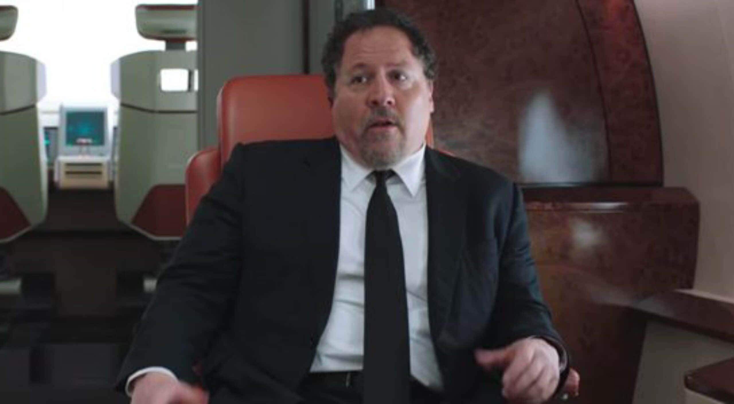 Jon Favreau, black suit, red leather chair, 2K Desktop Wallpaper