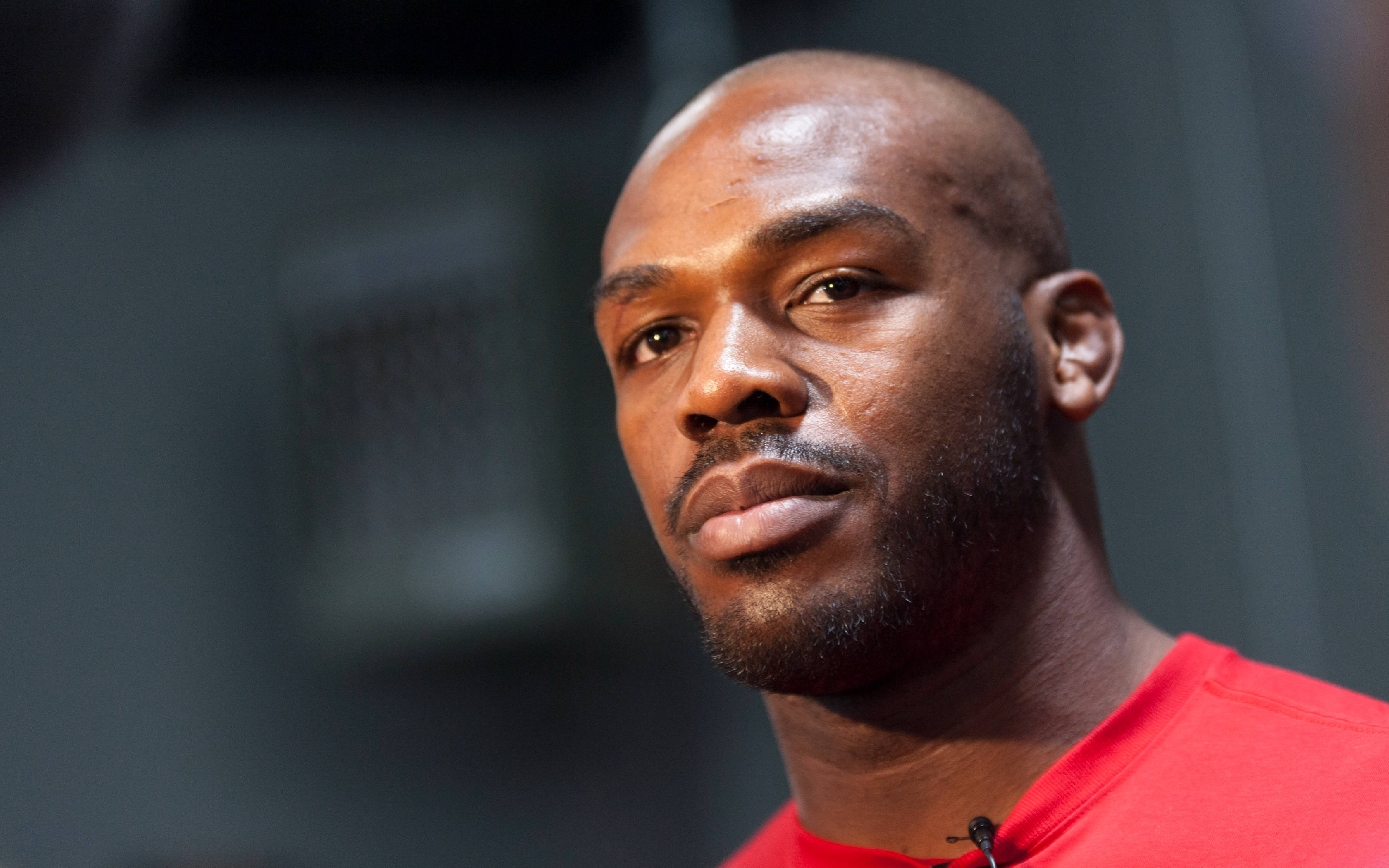 Jon Jones, red shirt, bald, 2K Desktop Wallpaper
