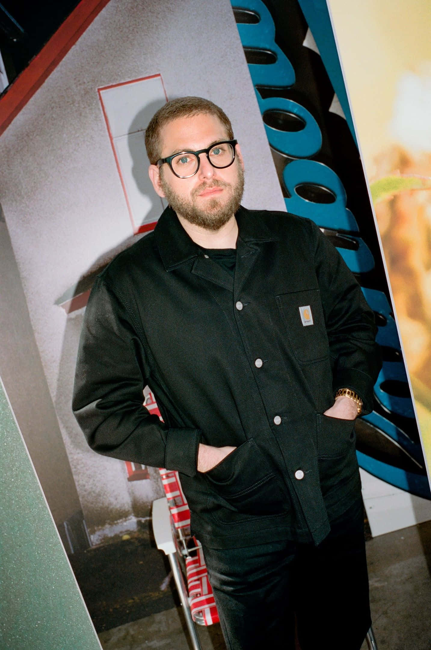 Jonah Hill, black Carhartt jacket, vibrant blue sky, Full HD Phone Wallpaper