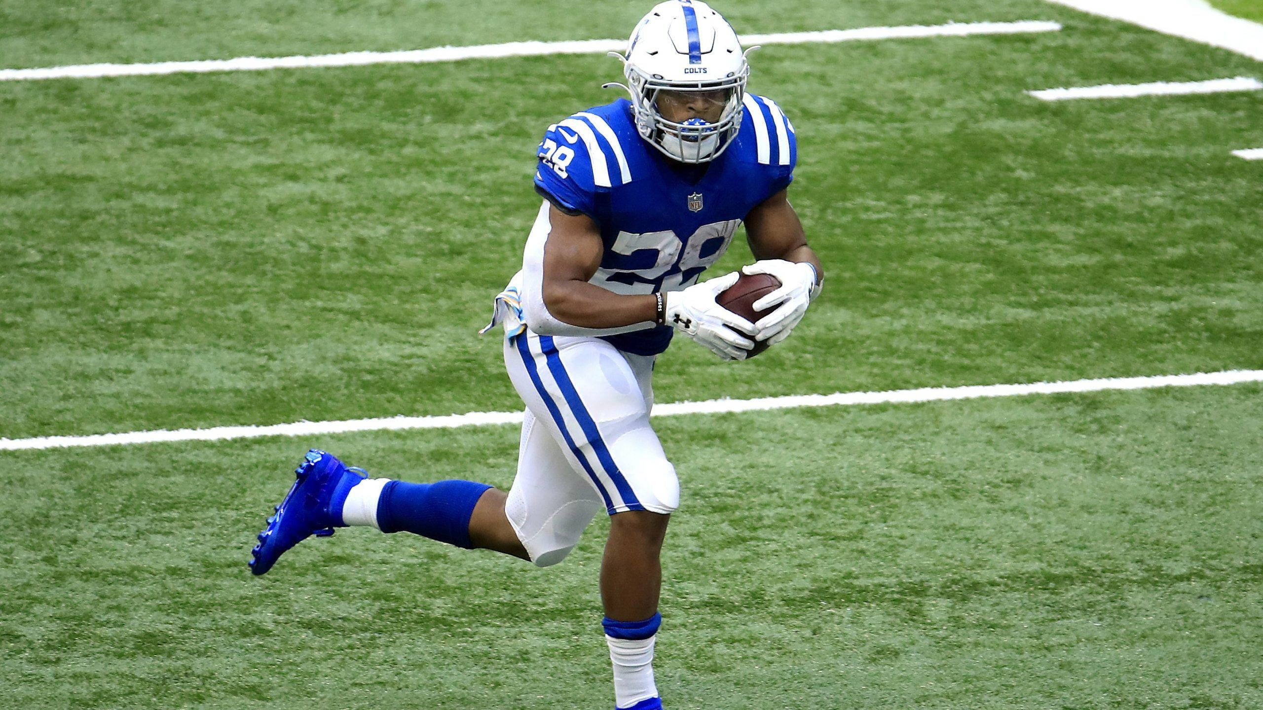 Jonathan Taylor, blue and white uniform, green turf, 2K Desktop Wallpaper