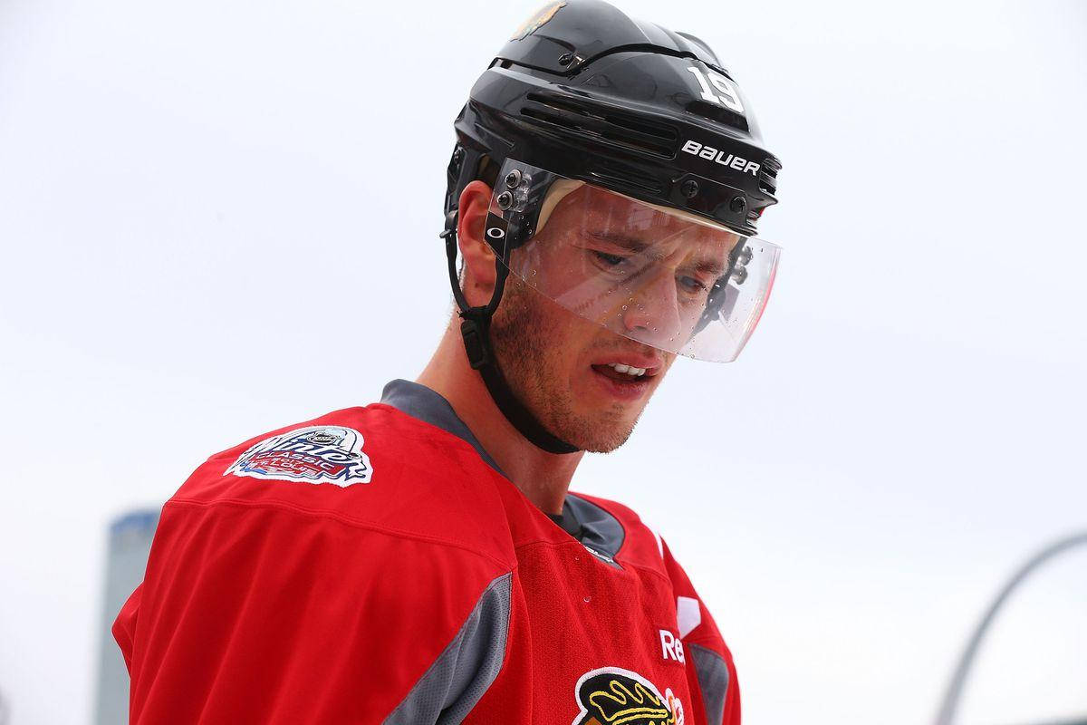 Jonathan Toews, red jersey, black helmet, SD Desktop Wallpaper