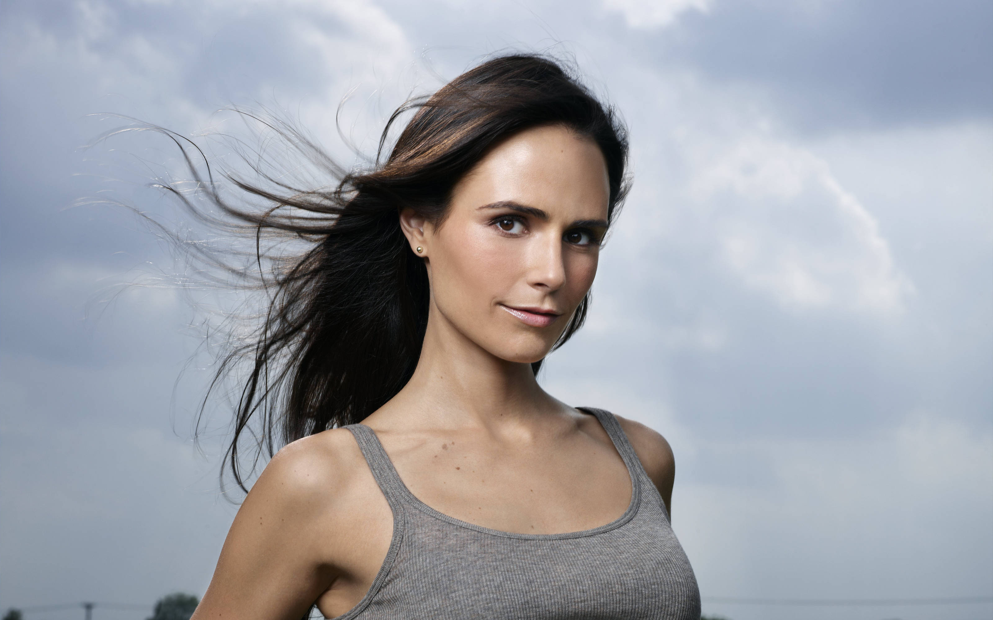 Jordana Brewster, cloudy sky, wind-swept dark hair, 2K Desktop Wallpaper