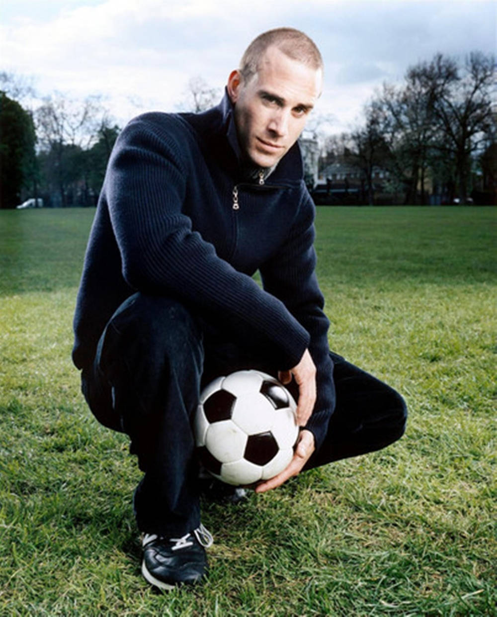 Joseph Fiennes, classic black and white soccer ball, dark sweater, SD Phone Wallpaper