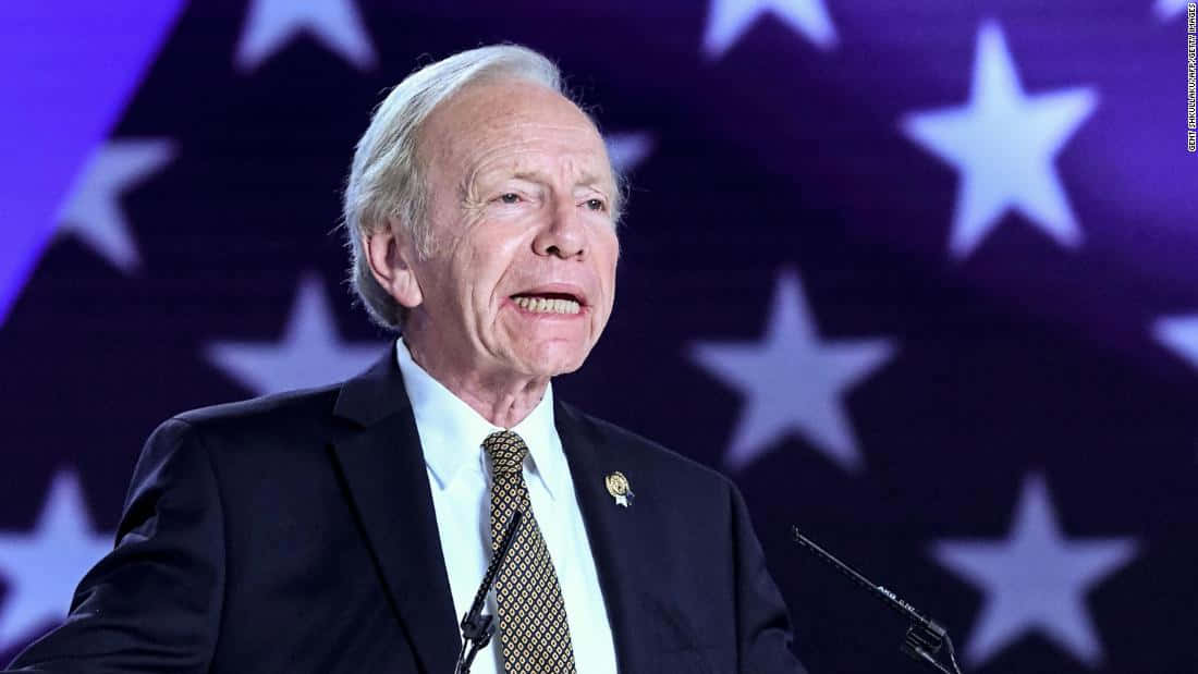 Joseph Lieberman, podium, glowing white stars, SD Desktop Wallpaper