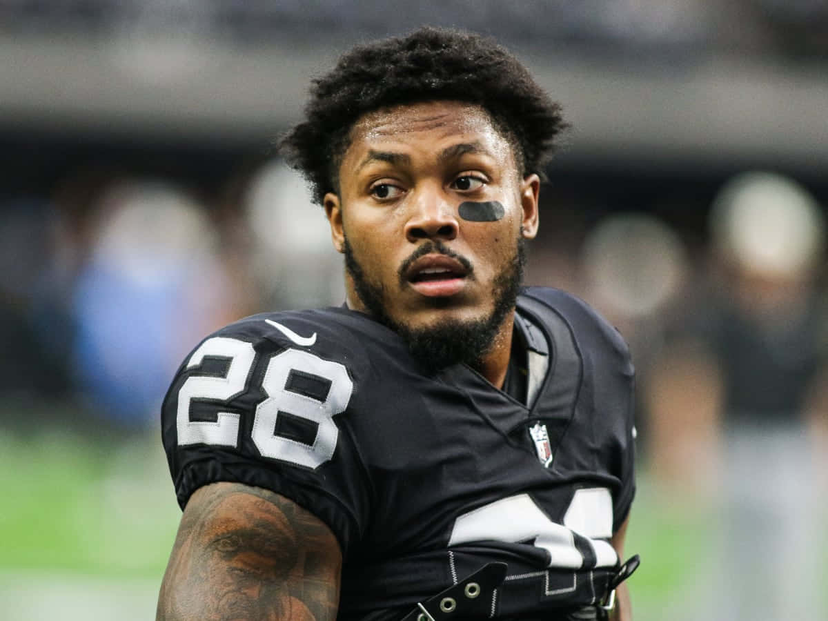 Josh Jacobs, number 28, black jersey, SD Desktop Wallpaper