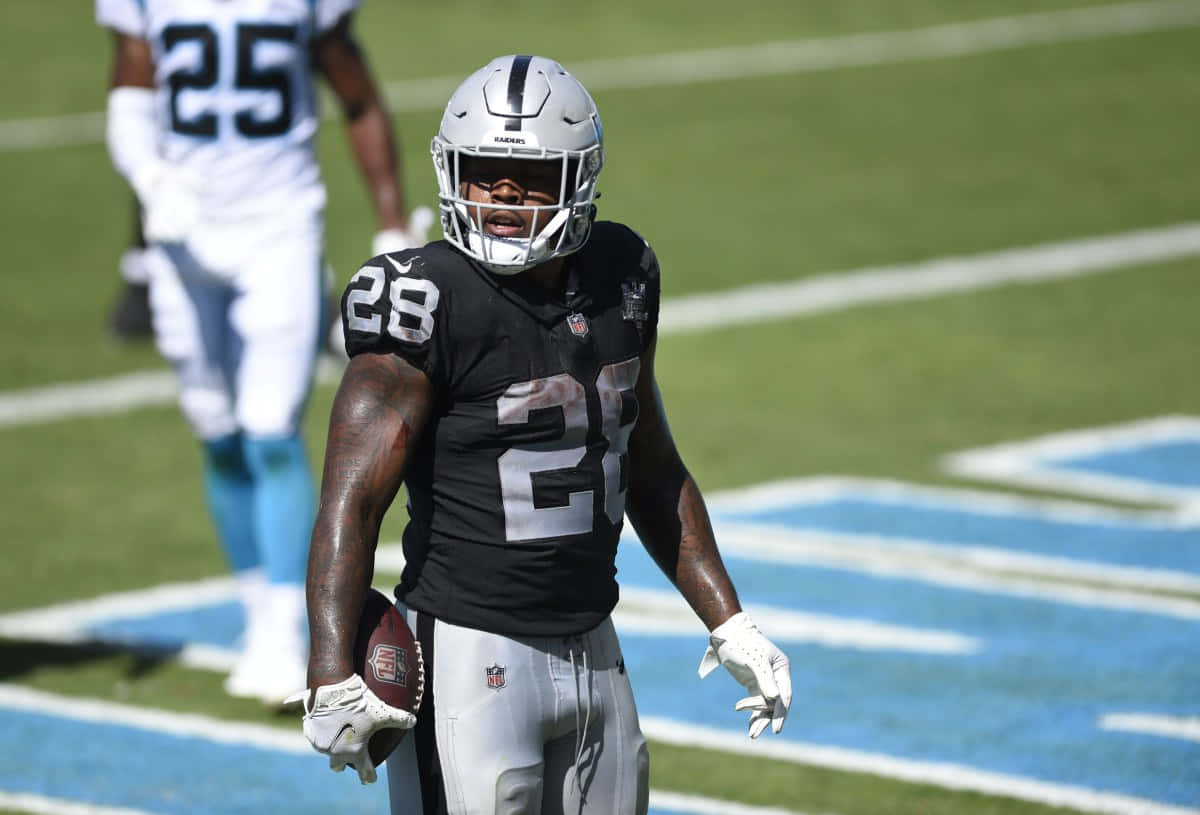 Josh Jacobs, number 28, black and silver uniform, SD Desktop Wallpaper
