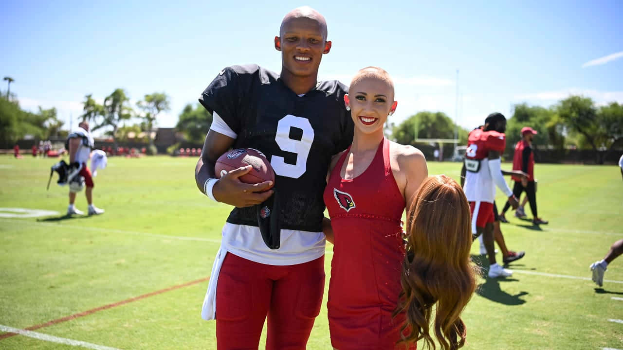 Joshua Dobbs, number 9 jersey, cheerleader in red, HD Desktop Wallpaper