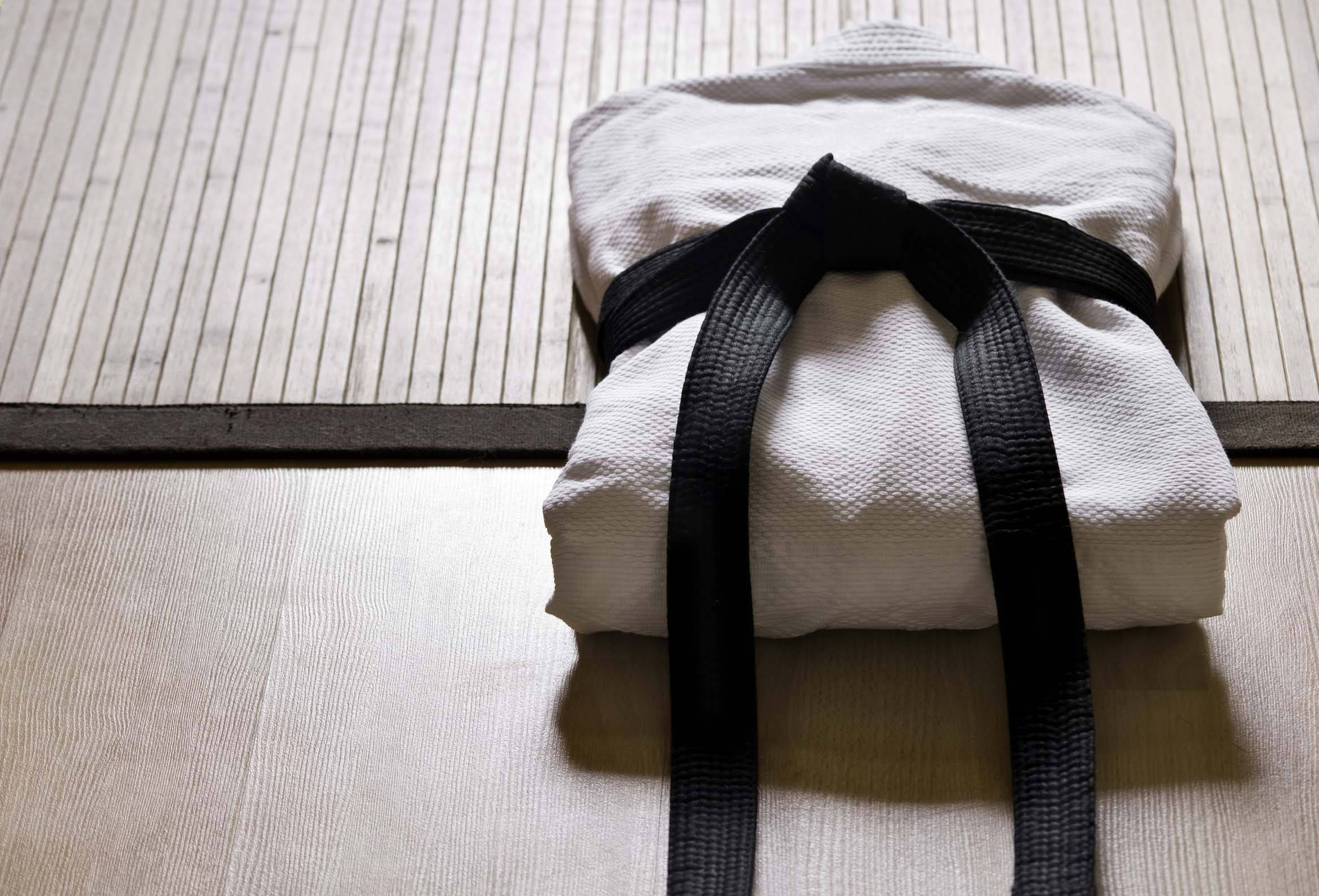 white judo uniform, black belt, light wooden floor mat, Full HD Desktop Wallpaper