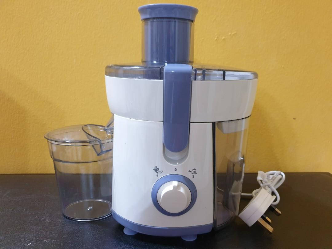 white and blue countertop juicer, dark table, textured yellow wall, SD Desktop Wallpaper
