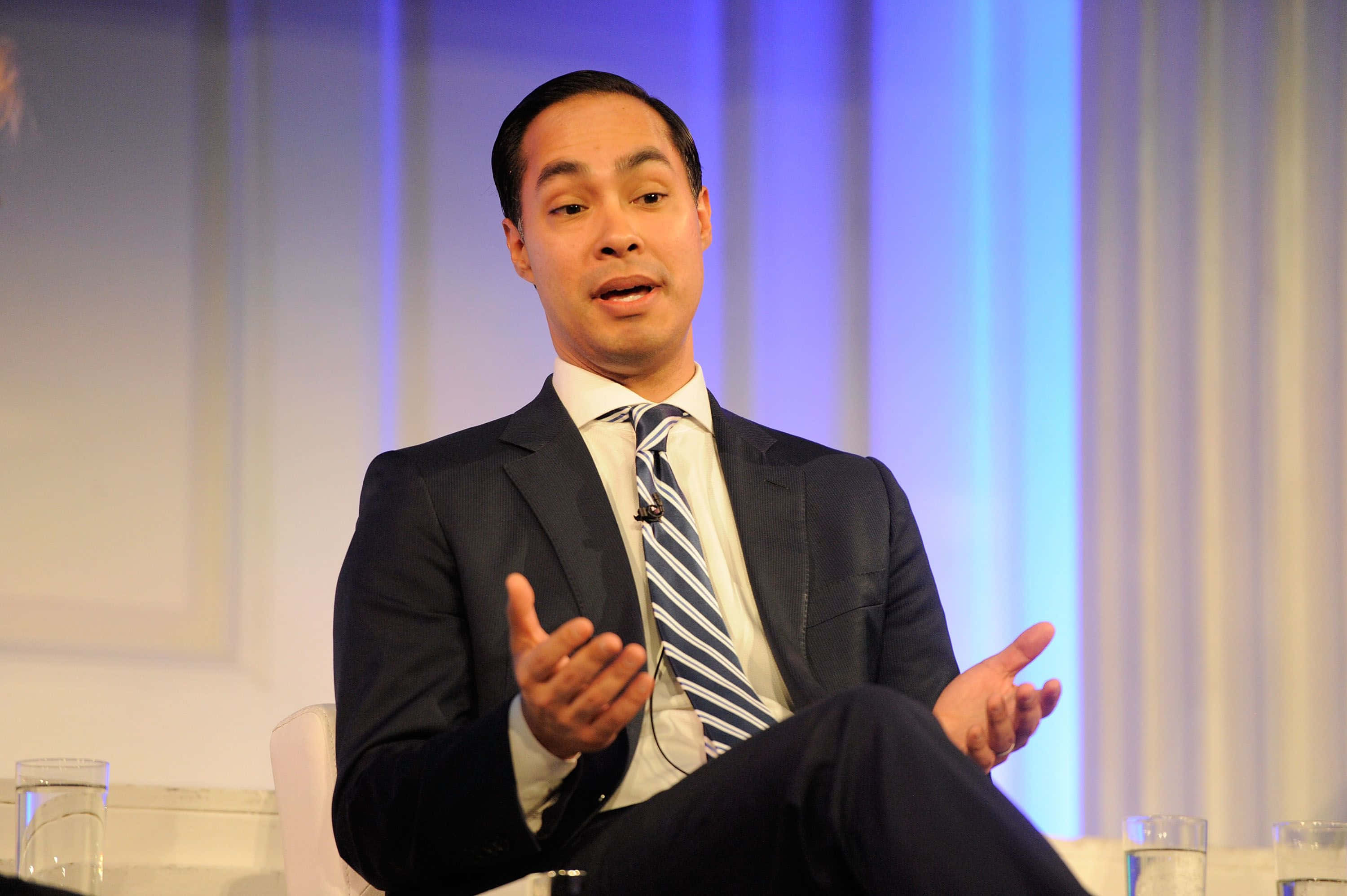 Julian Castro, dark suit, striped tie, 2K Desktop Wallpaper