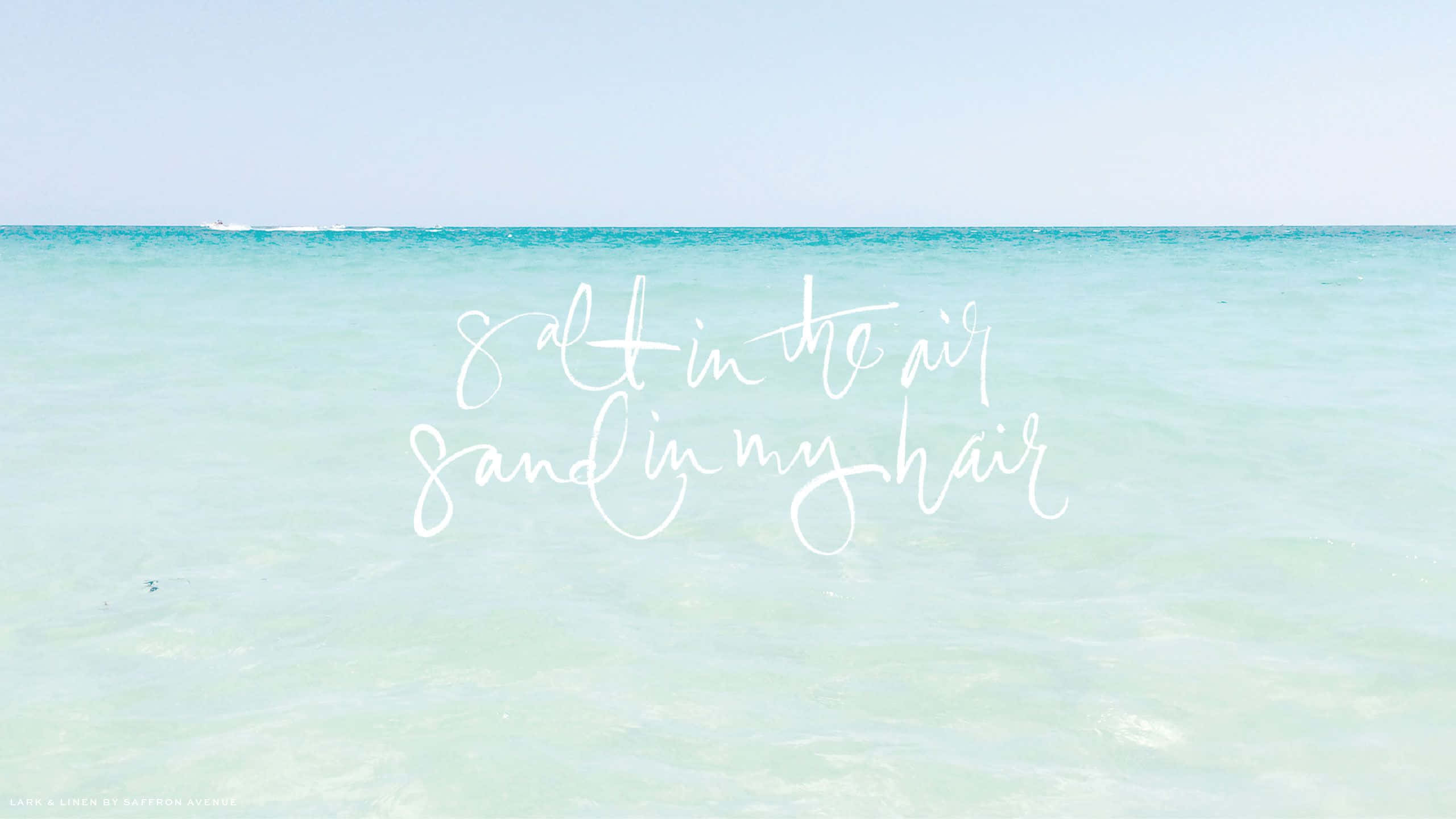 turquoise ocean, pale sky, white cursive text, 2K Desktop Wallpaper