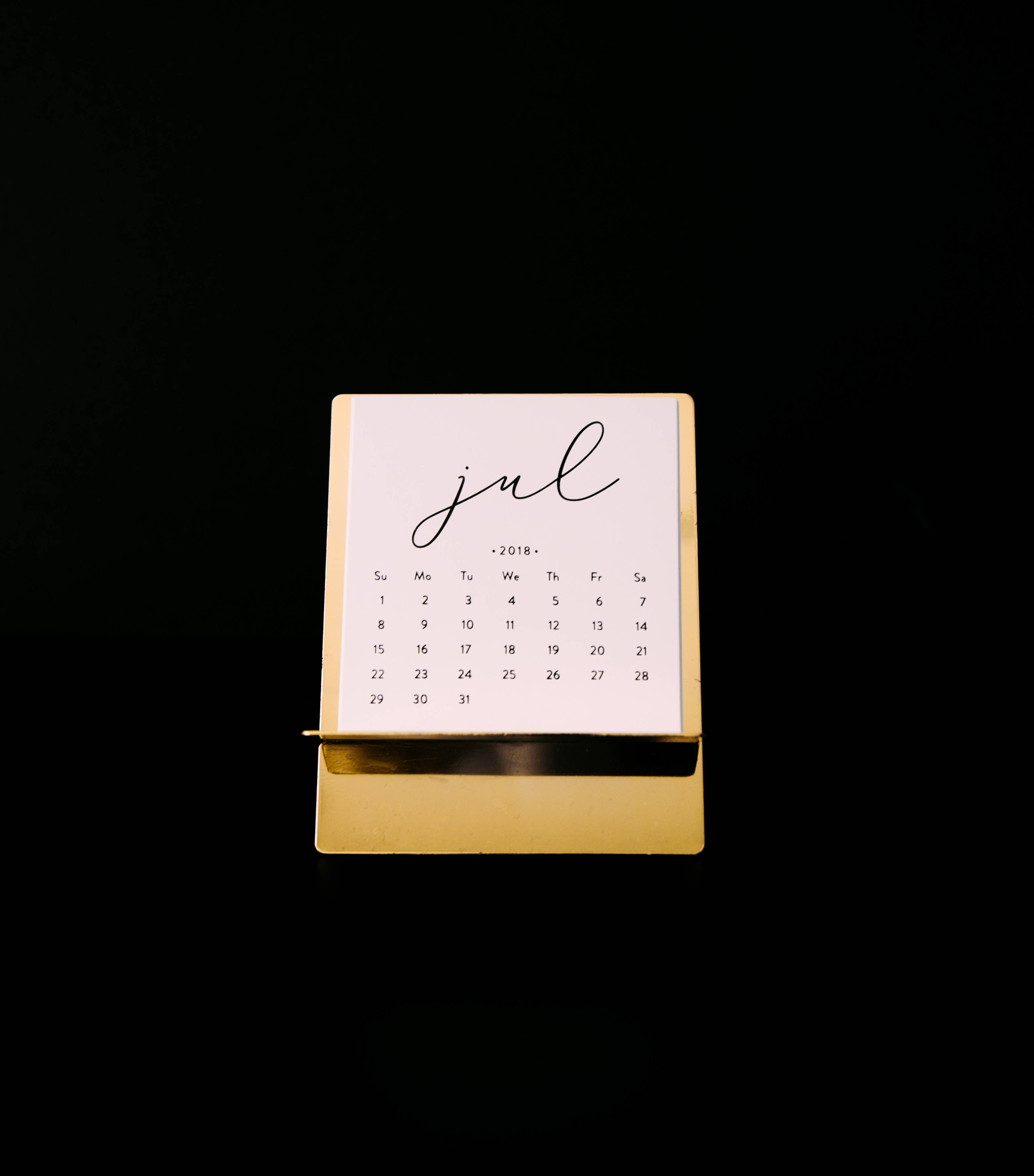 July 2018, gold desk calendar, stark black background, 4K Phone Wallpaper