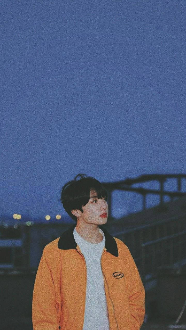 Jungkook, orange jacket, twilight sky, HD Phone Wallpaper