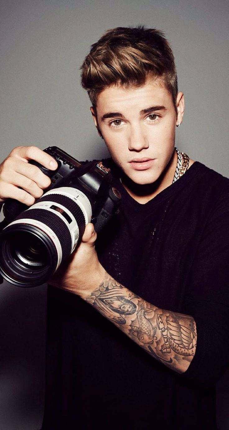 Justin Bieber, DSLR camera, plain gray background, HD Phone Wallpaper