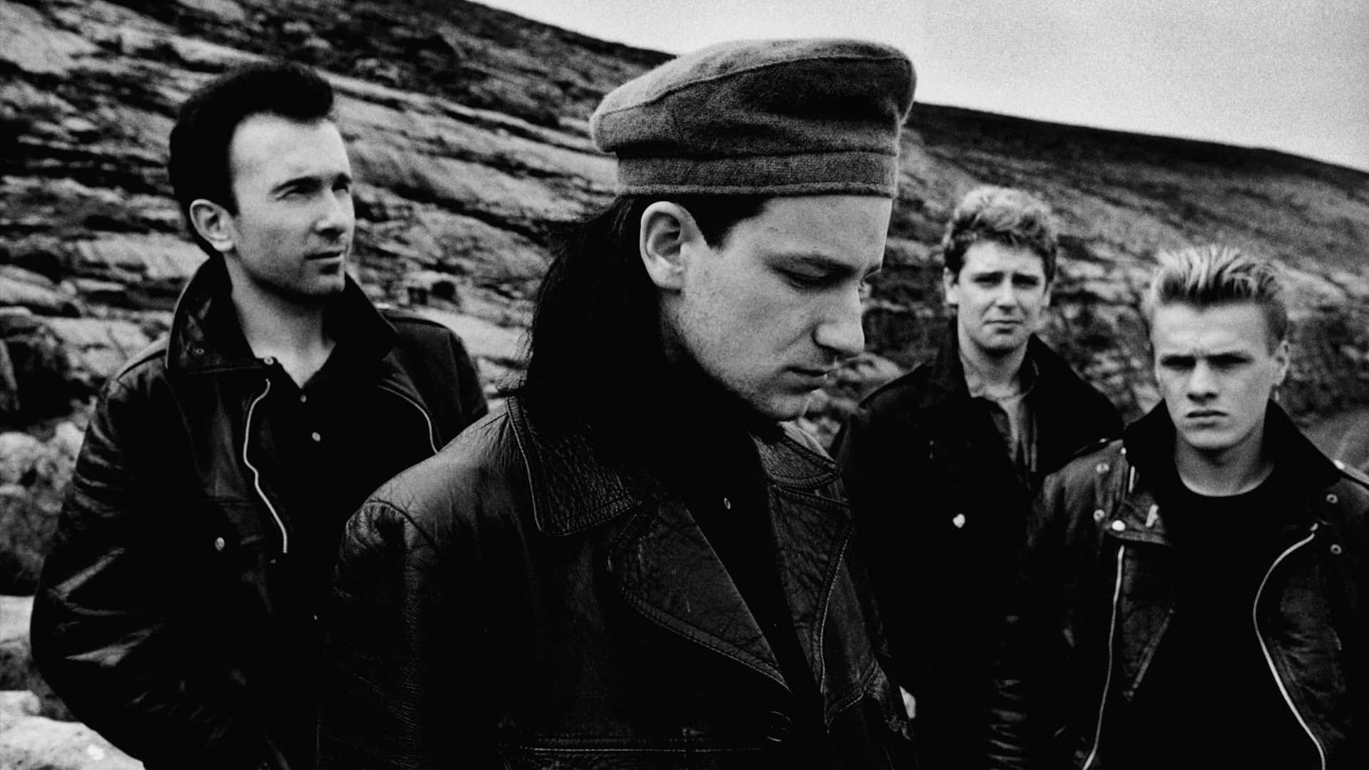 Musical Juvenile Band, leather jackets, rocky hillside, Full HD Desktop Wallpaper