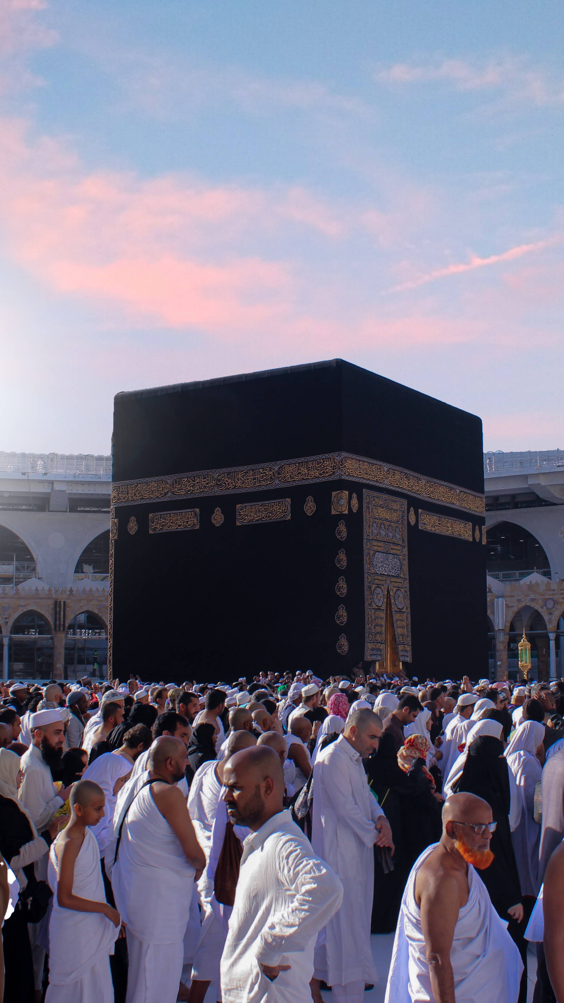 Kaaba, white ihram garments, soft pink and blue twilight sky, 4K Phone Wallpaper