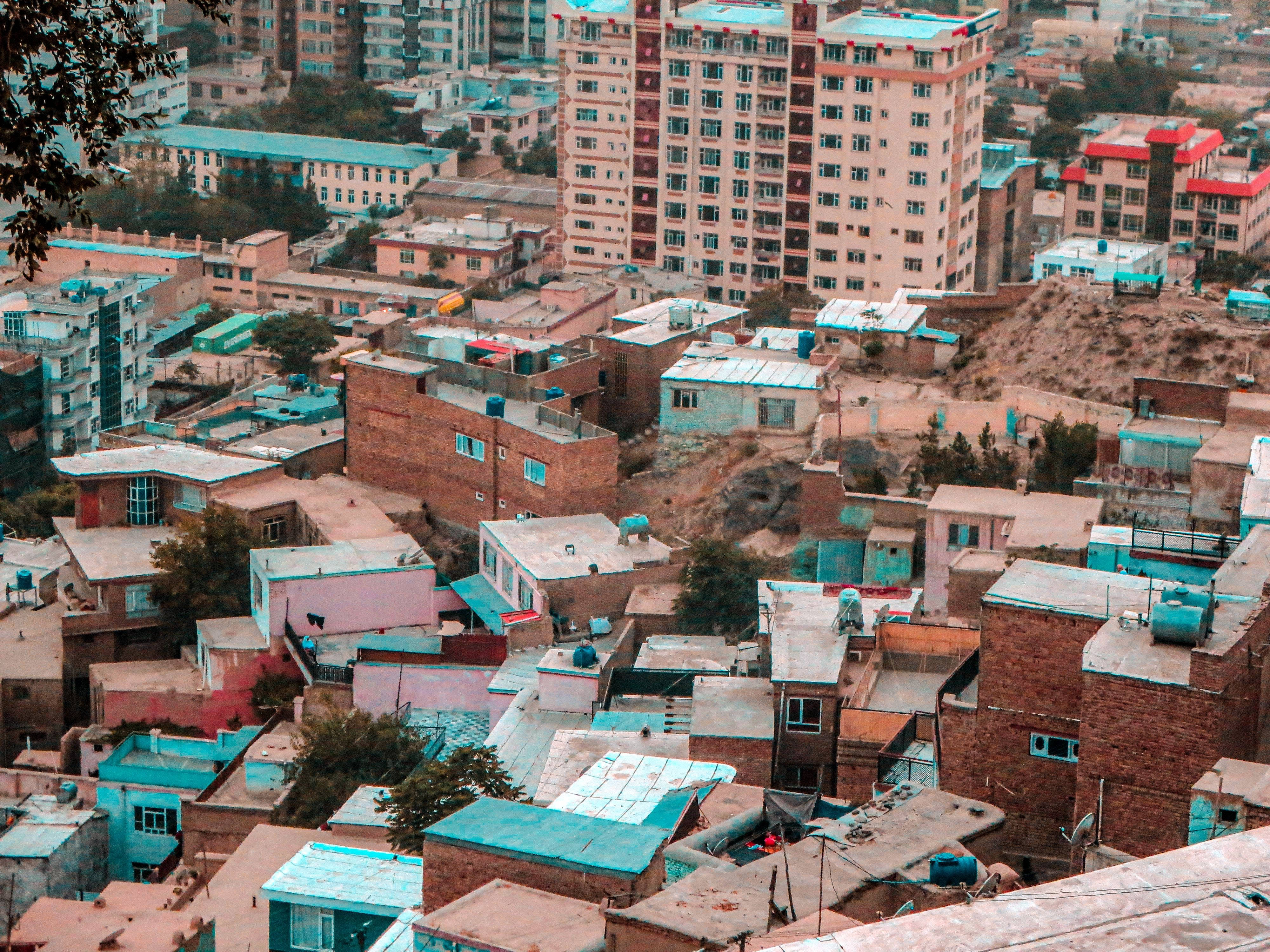 Kabul, terracotta brick buildings, vibrant turquoise roofs, 4K Desktop Wallpaper