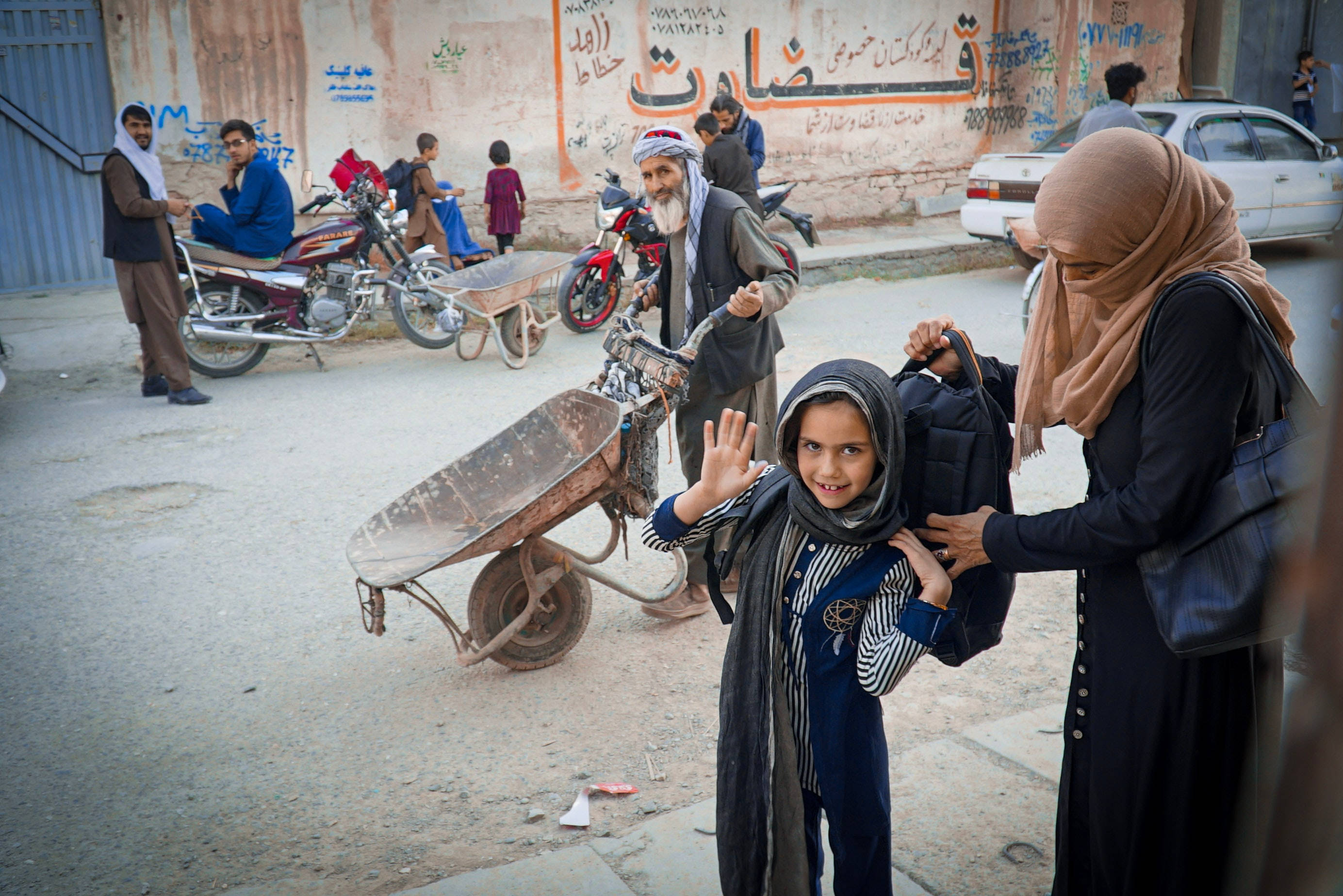 Kabul, dusty street, motorbikes, 2K Desktop Wallpaper
