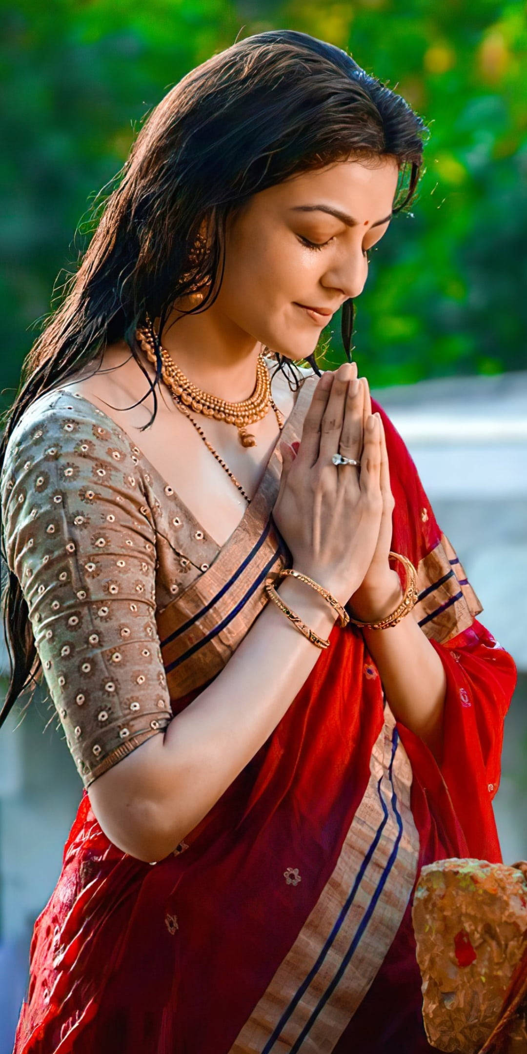 Kajal Agarwal, red and gold sari, prays with hands clasped, Full HD Phone Wallpaper