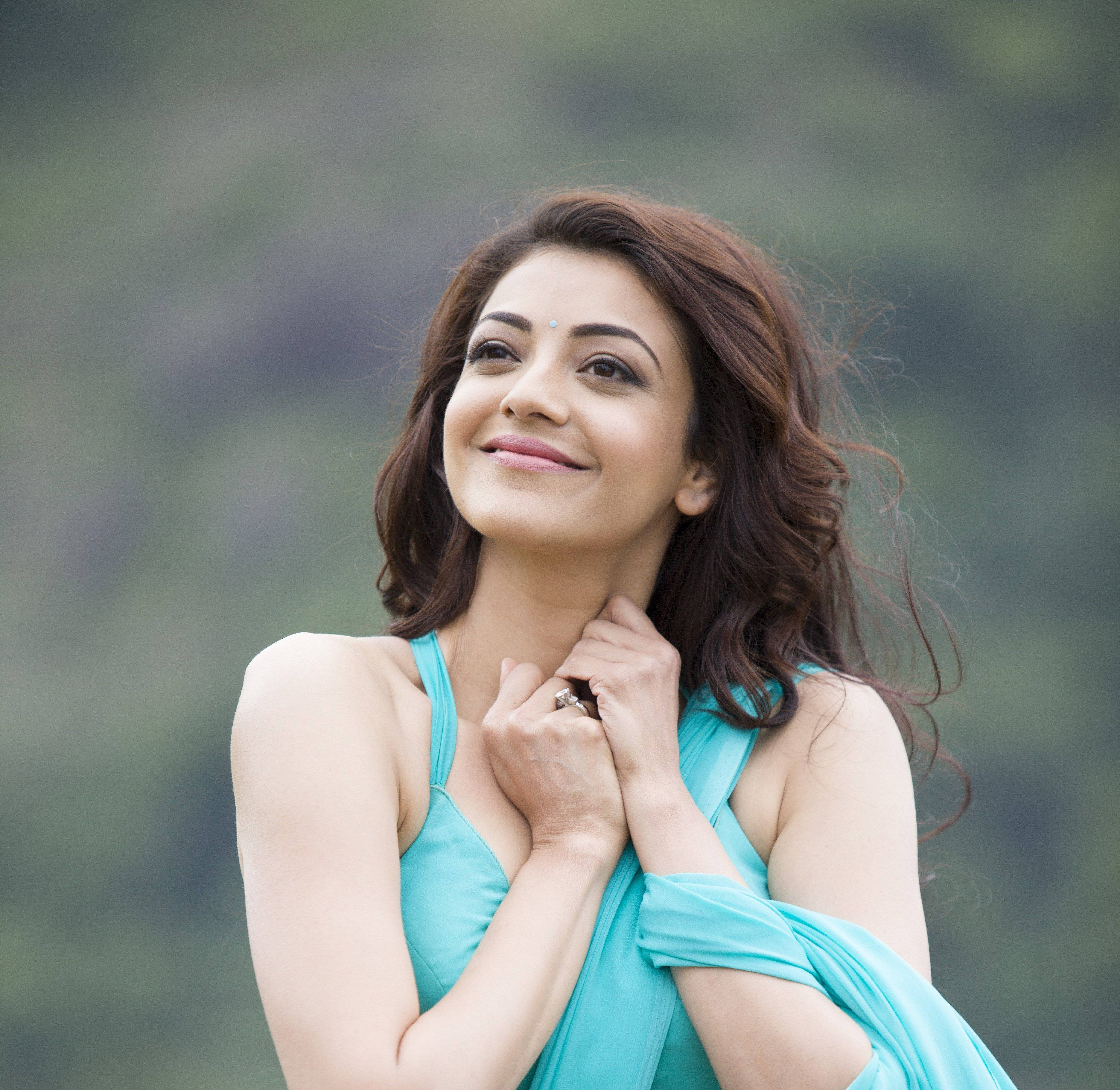 Kajal Agarwal, turquoise dress, soft green blurred background, 2K Desktop Wallpaper
