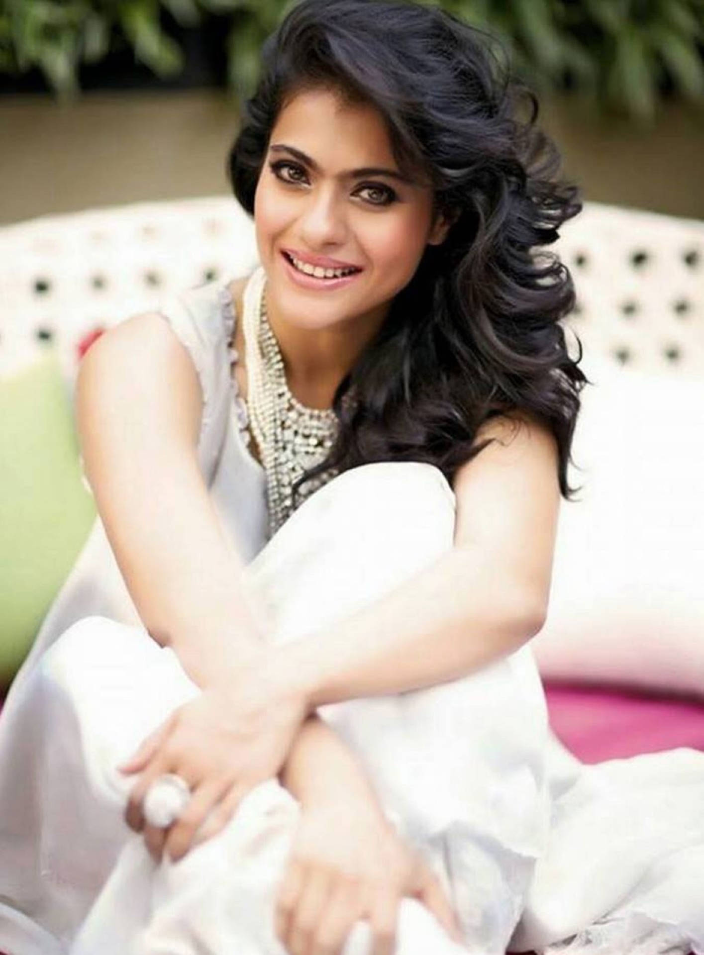 Kajol, dark wavy hair, patterned outdoor sofa, Full HD Phone Wallpaper