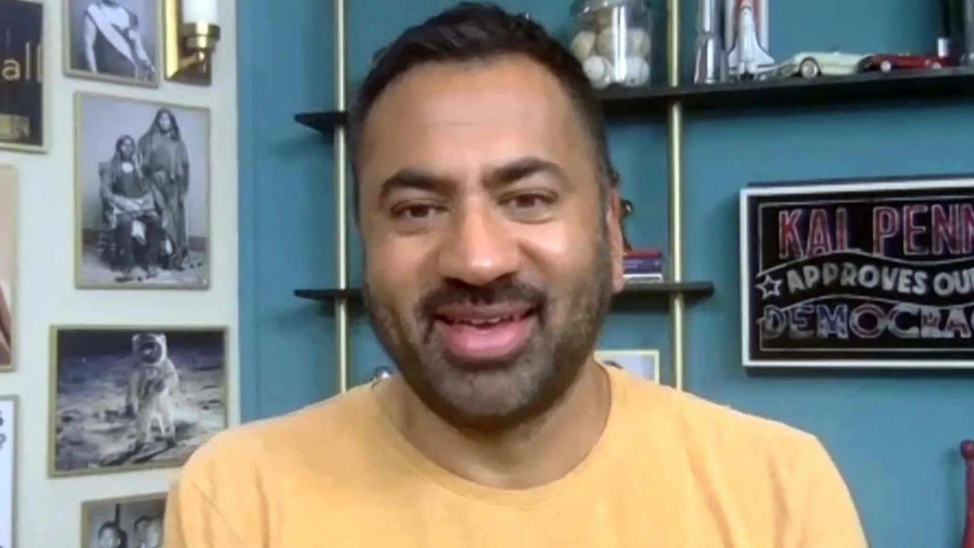 Kal Penn, yellow shirt, teal wall, Full HD Desktop Wallpaper