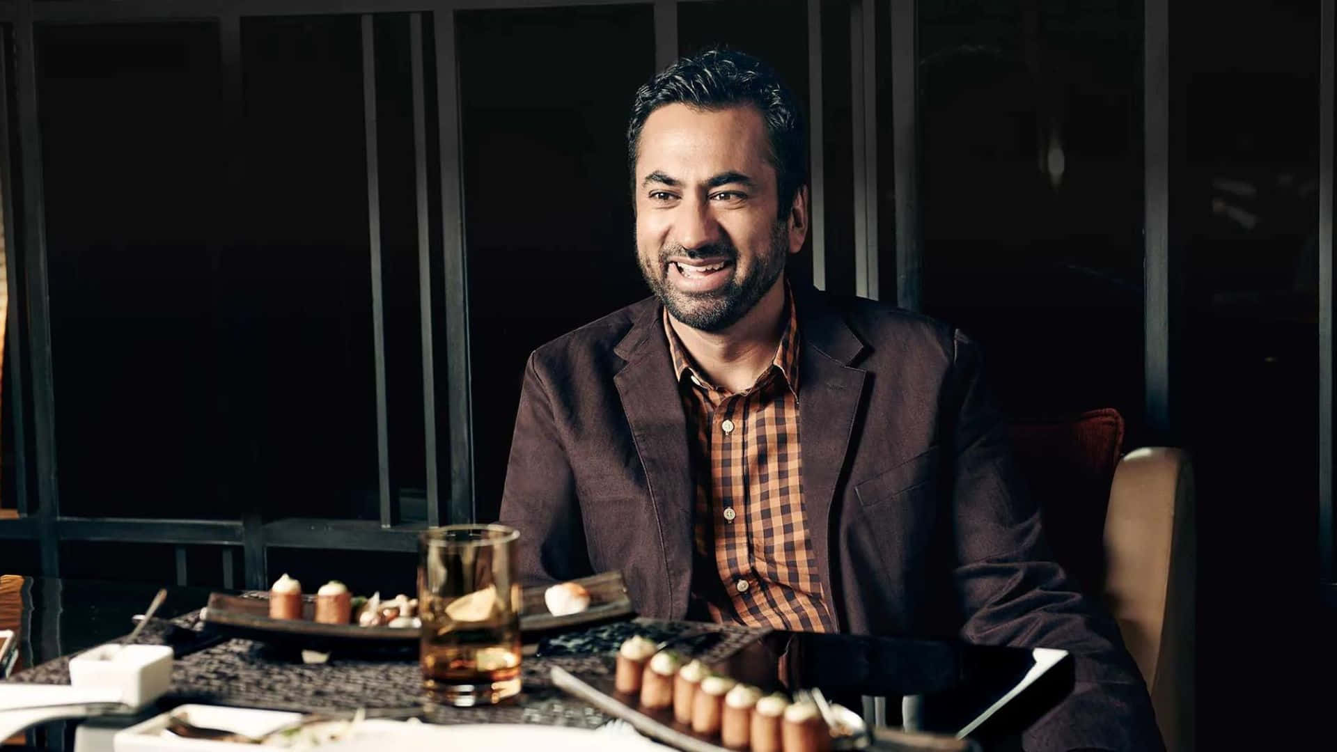Kal Penn, brown blazer, dimly lit table, Full HD Desktop Wallpaper
