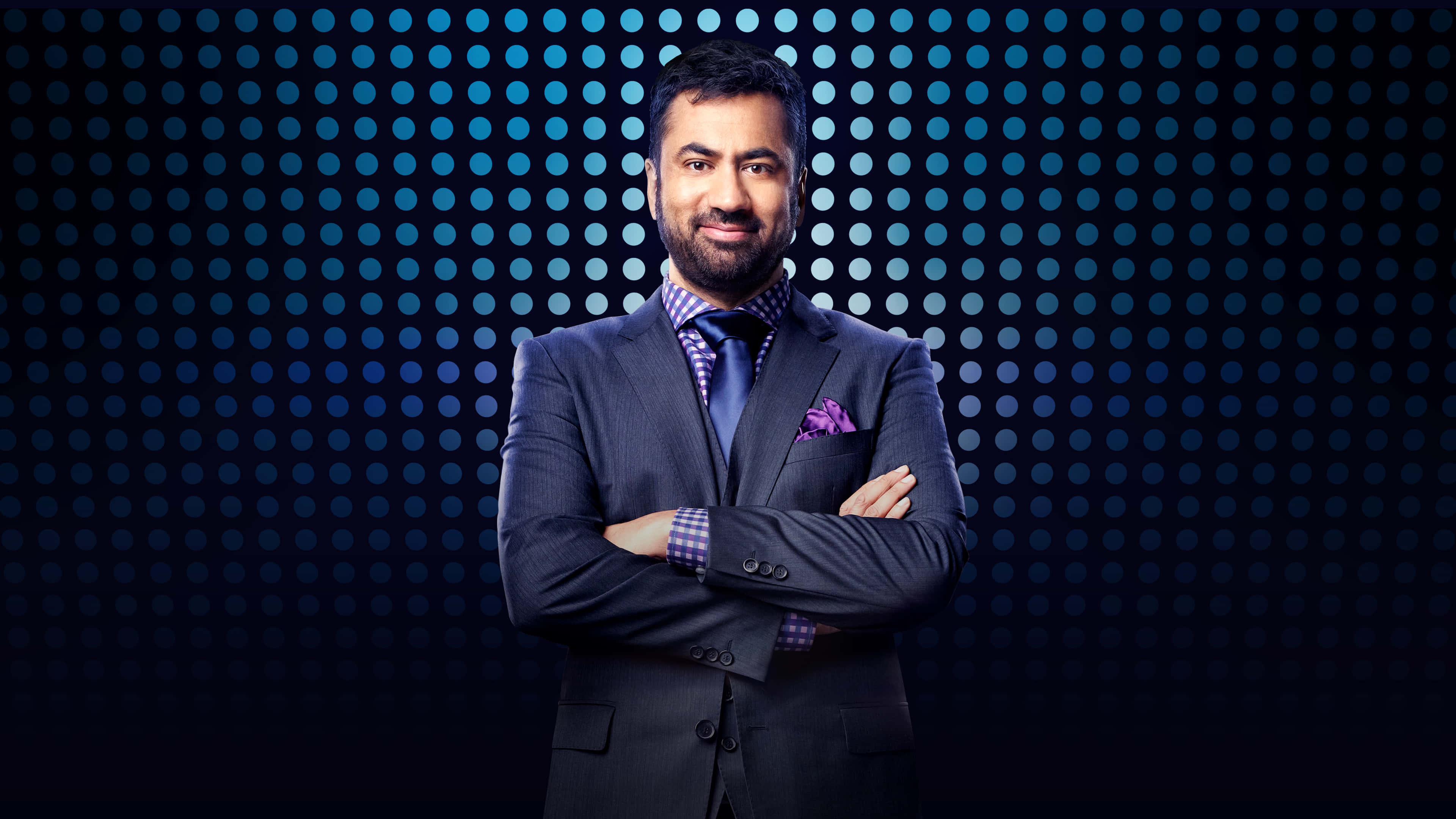 Kal Penn, sharp suit, glowing blue dot patterned backdrop, 4K Desktop Wallpaper