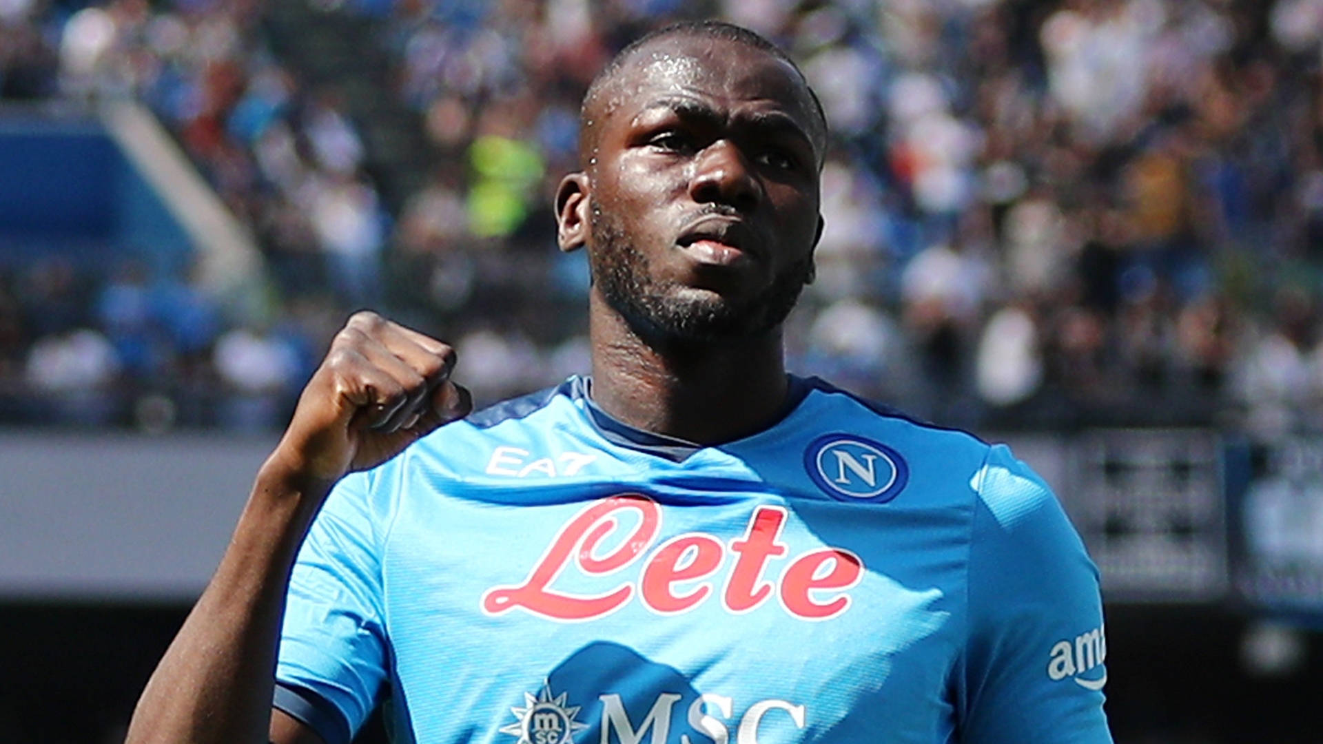 Kalidou Koulibaly, blue Napoli jersey, sunlit stadium field, Full HD Desktop Wallpaper