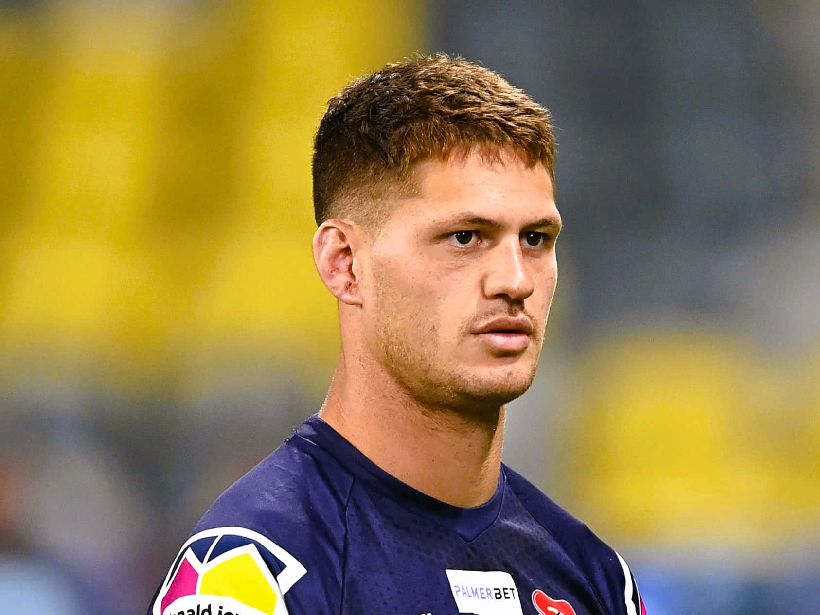 Kalyn Ponga, dark blue jersey, yellow stadium crowd, HD Desktop Wallpaper