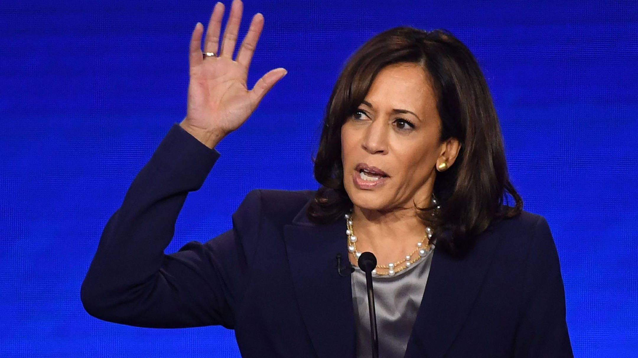 Kamala Harris, podium, solid blue background, Full HD Desktop Wallpaper