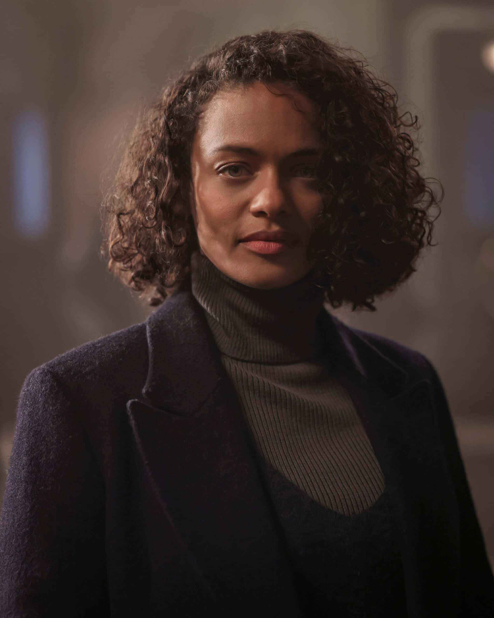 Kandyse McClure, black coat, curly brown hair, 2K Phone Wallpaper