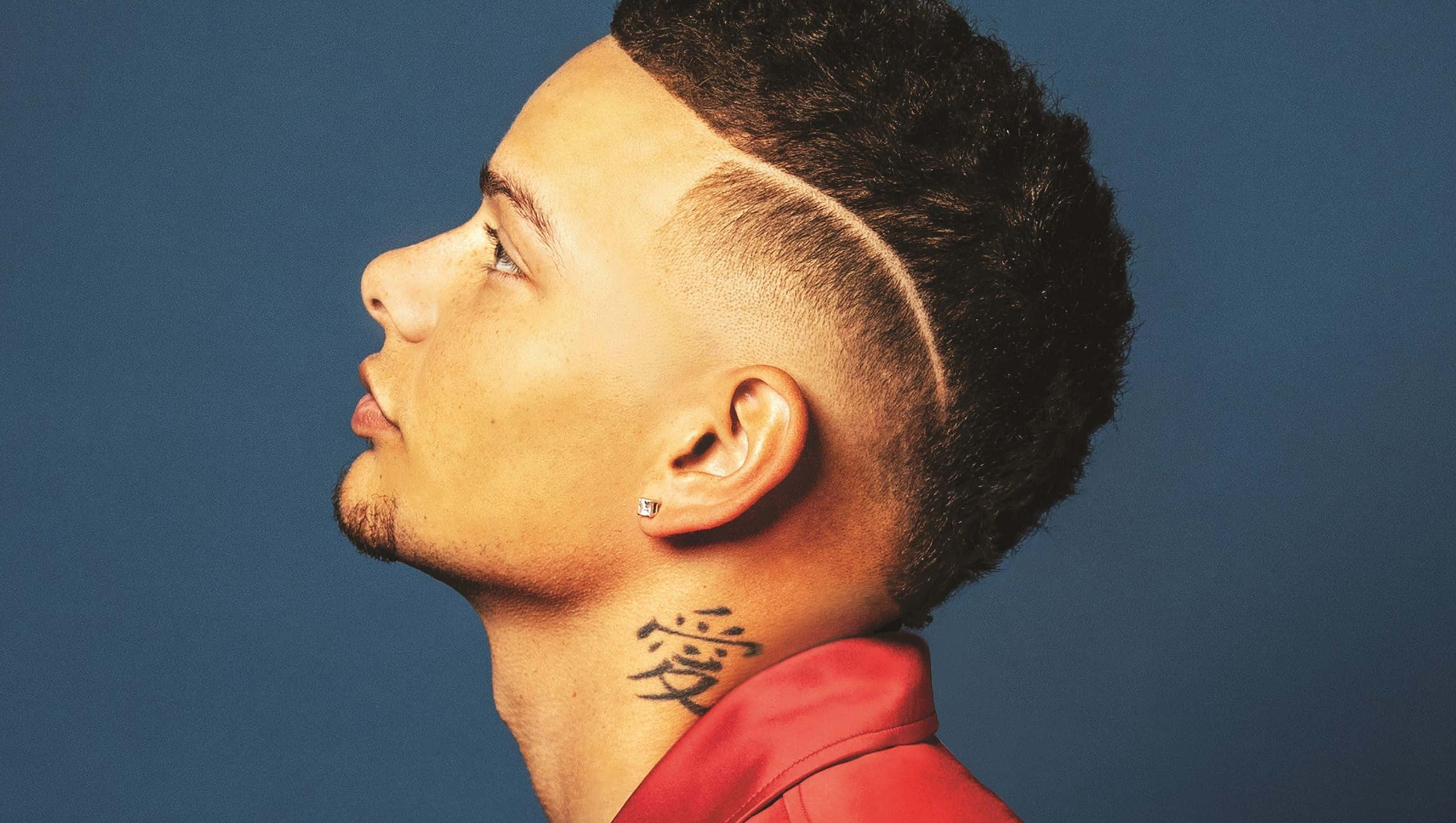 Kane Brown, red jacket, tattoo of the kanji for love, 2K Desktop Wallpaper