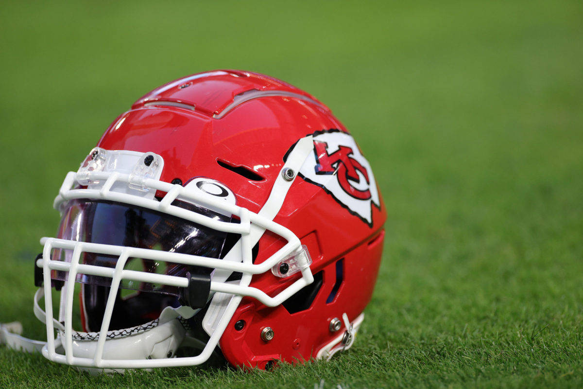 Kansas City Chiefs, shiny red football helmet, vibrant green grass, SD Desktop Wallpaper