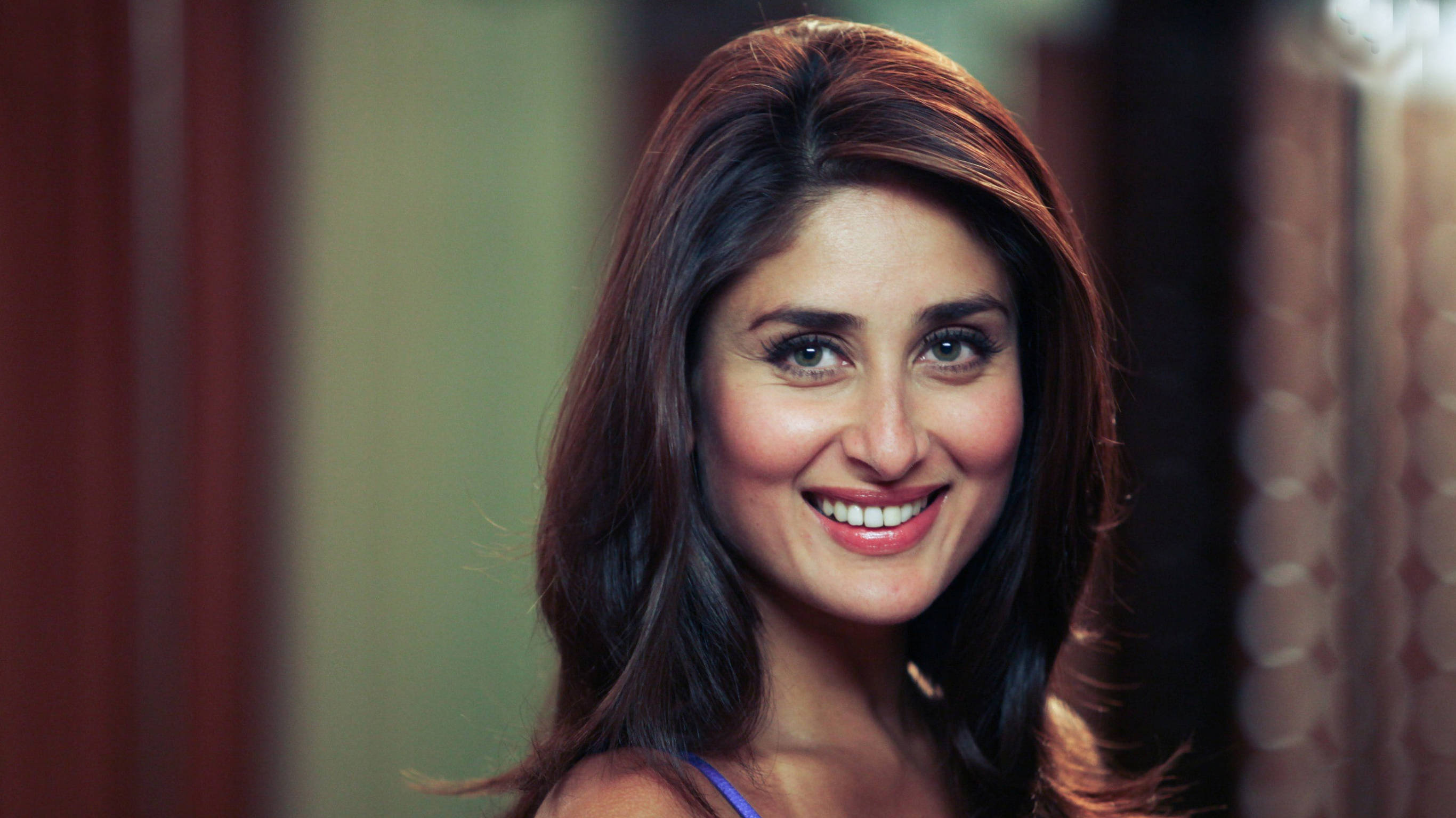 Kareena Kapoor, long dark hair, softly lit indoor setting, 2K Desktop Wallpaper