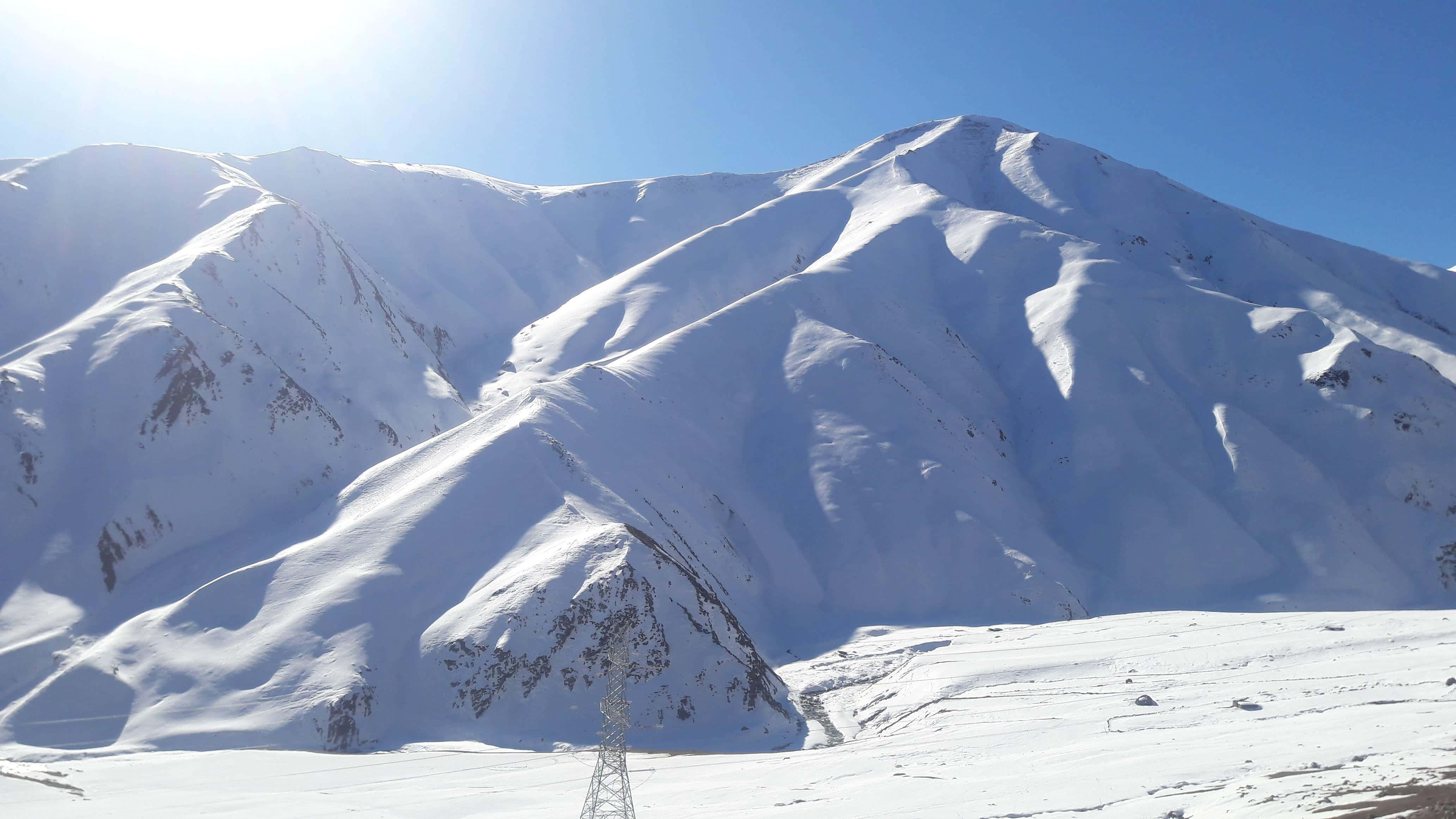 Kashmir, snow-covered mountains, clear blue sky, 4K Desktop Wallpaper