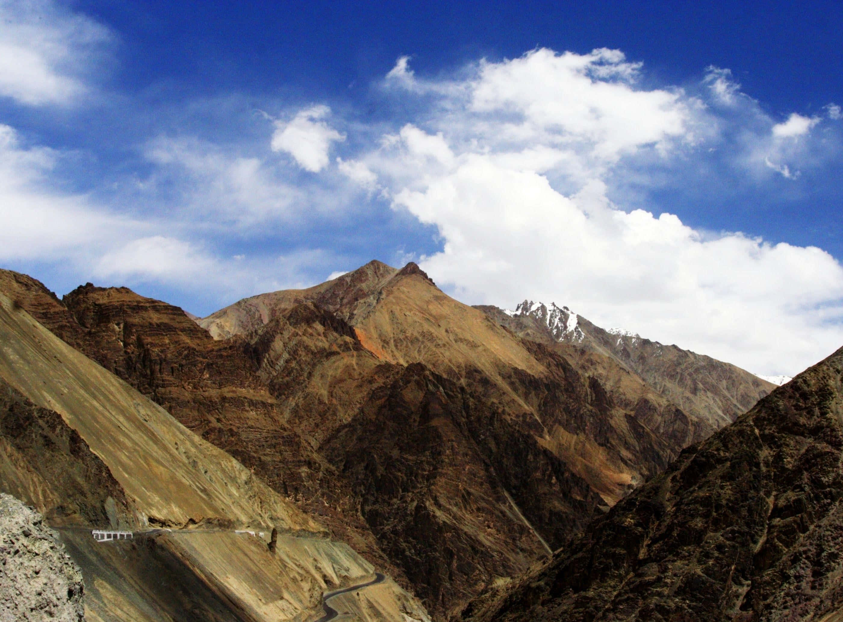 Kashmir, mountain pass road, rugged brown mountains, 2K Desktop Wallpaper