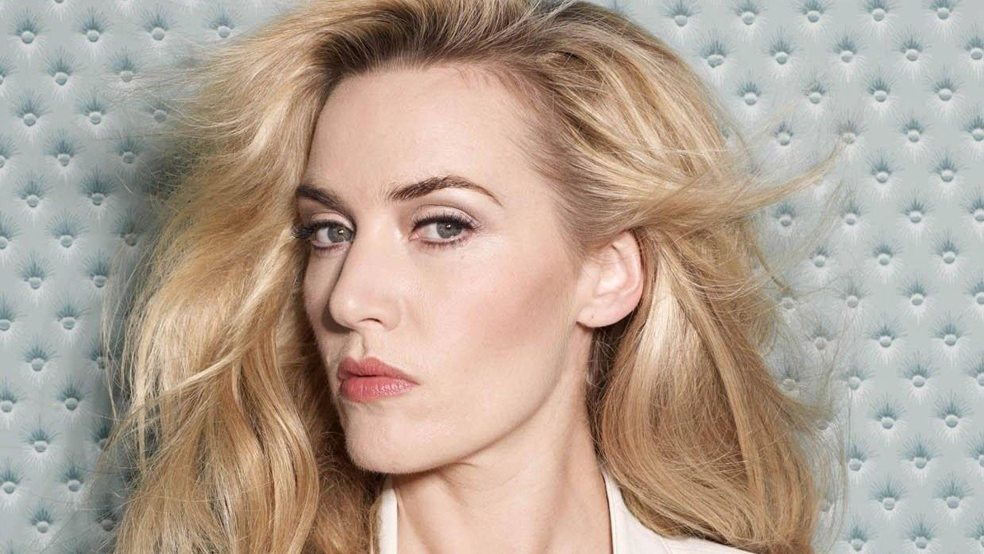 Kate Winslet, golden blonde hair, textured light blue tufted background, Full HD Desktop Wallpaper