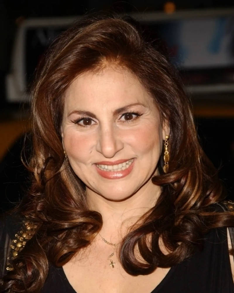 Kathy Najimy, glowing wavy brown hair, gold earrings, SD Phone Wallpaper