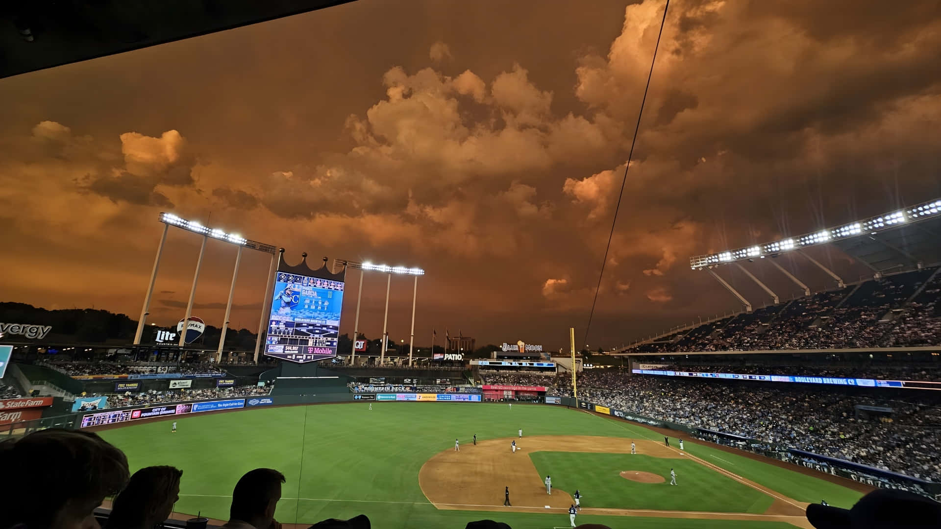 Kauffman Stadium, night game, vibrant orange sky, Full HD Desktop Wallpaper
