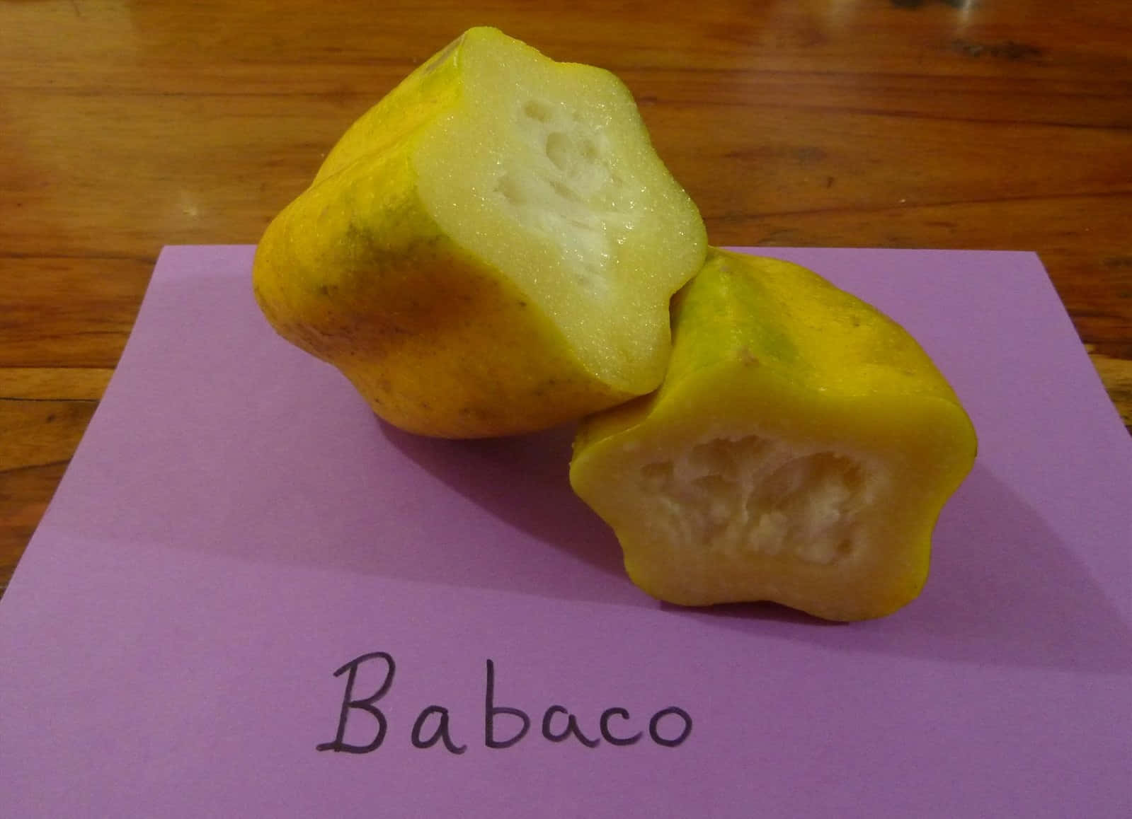 sliced yellow babaco, purple paper labeled babaco, wooden surface, HD Desktop Wallpaper