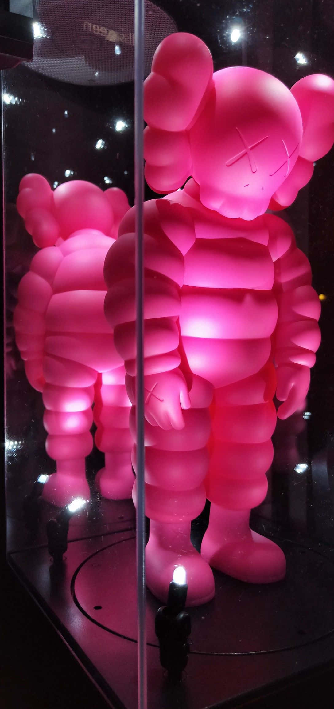 KAWS Chum, glowing pink, glass display case, Full HD Phone Wallpaper