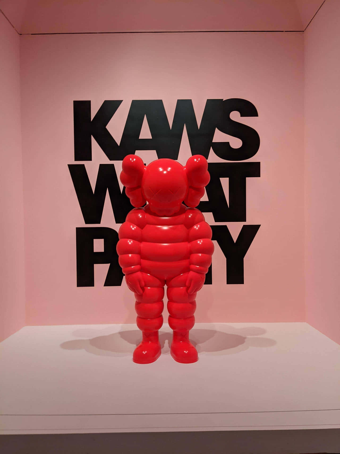 Red KAWS Figure, glossy red, balloon-like sculpture, Full HD Phone Wallpaper