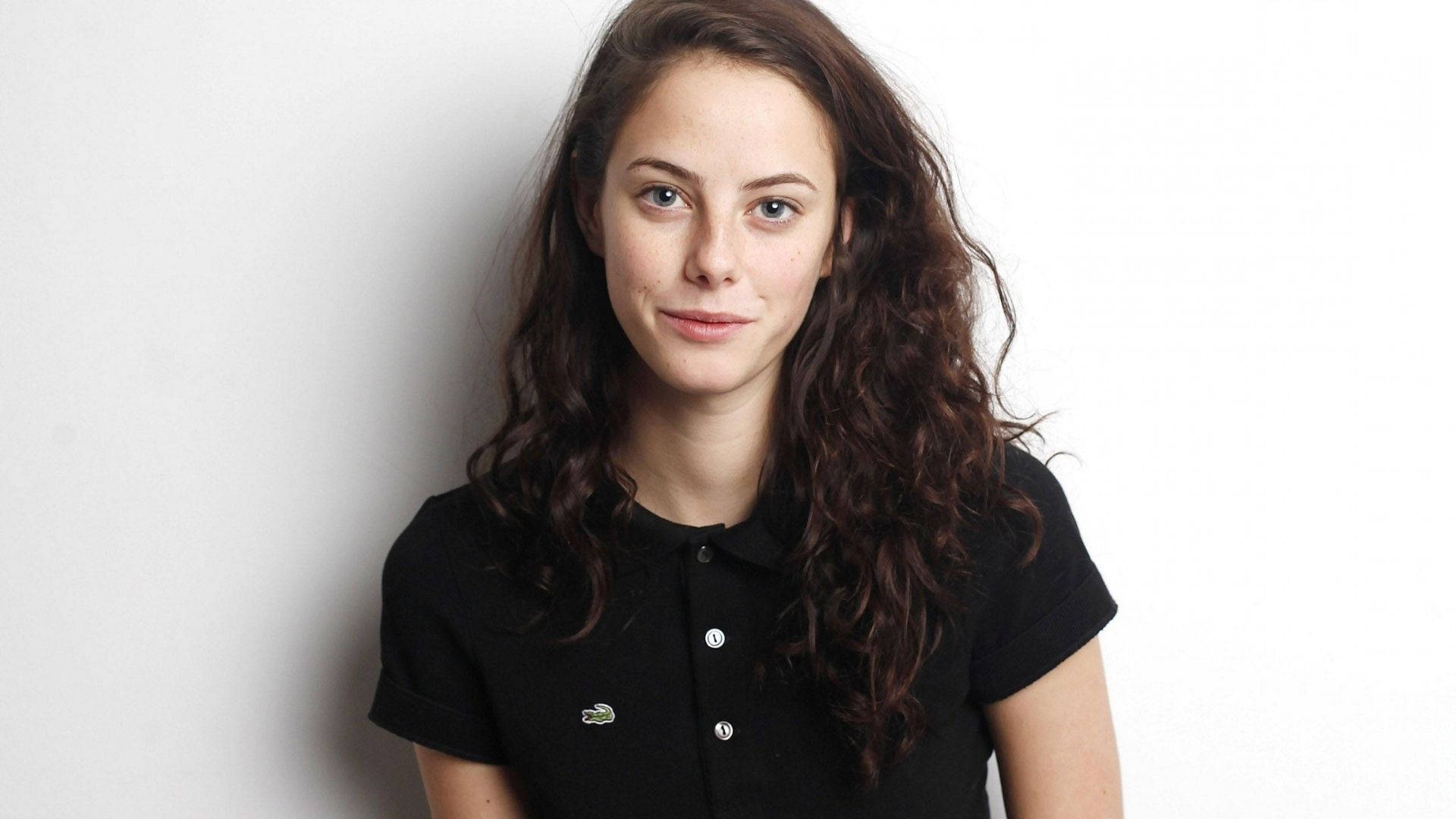 Kaya Scodelario, wavy brown hair, black polo shirt, Full HD Desktop Wallpaper