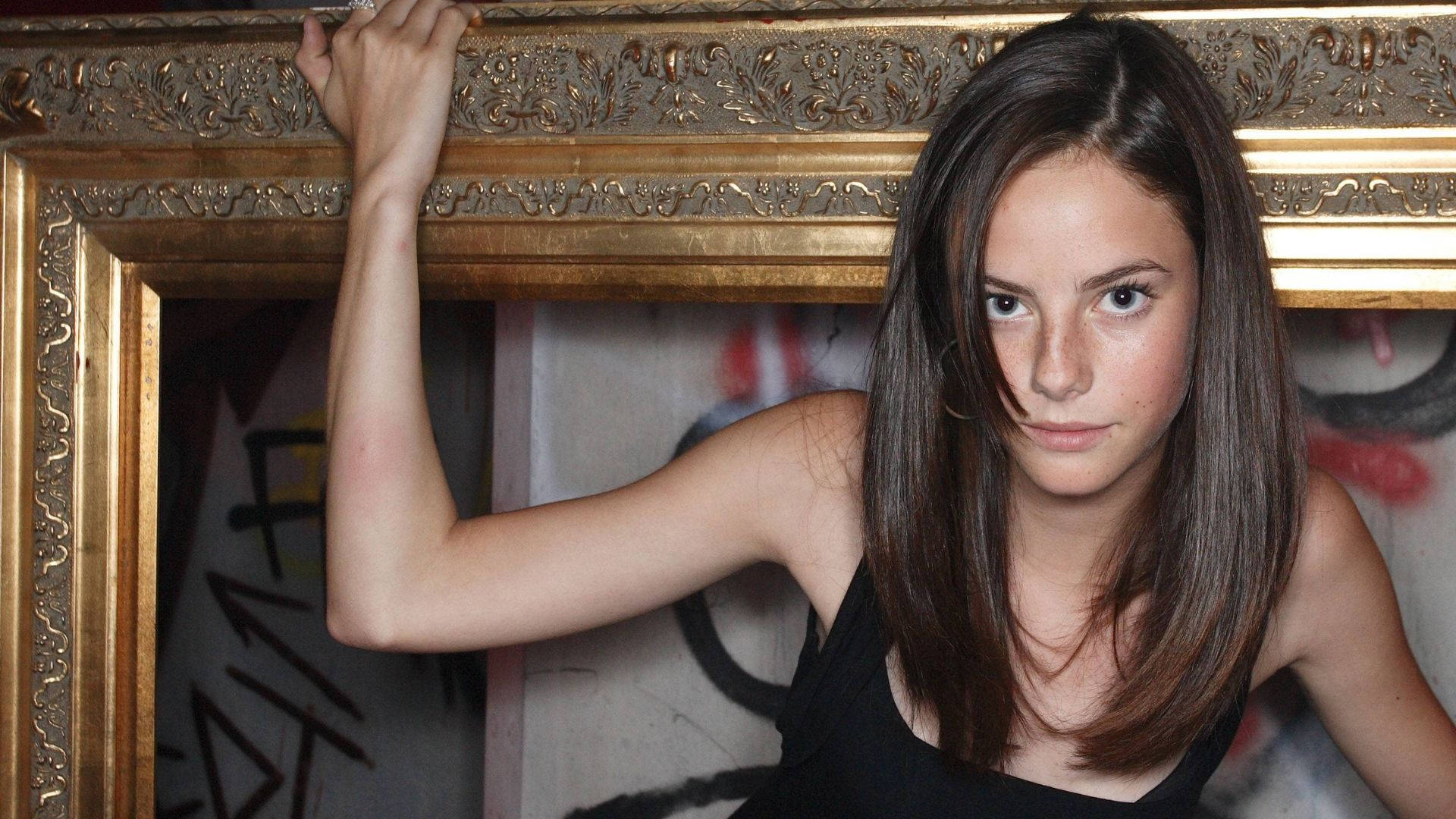 Kaya Scodelario, ornate gold picture frame, graffiti-covered wall, Full HD Desktop Wallpaper