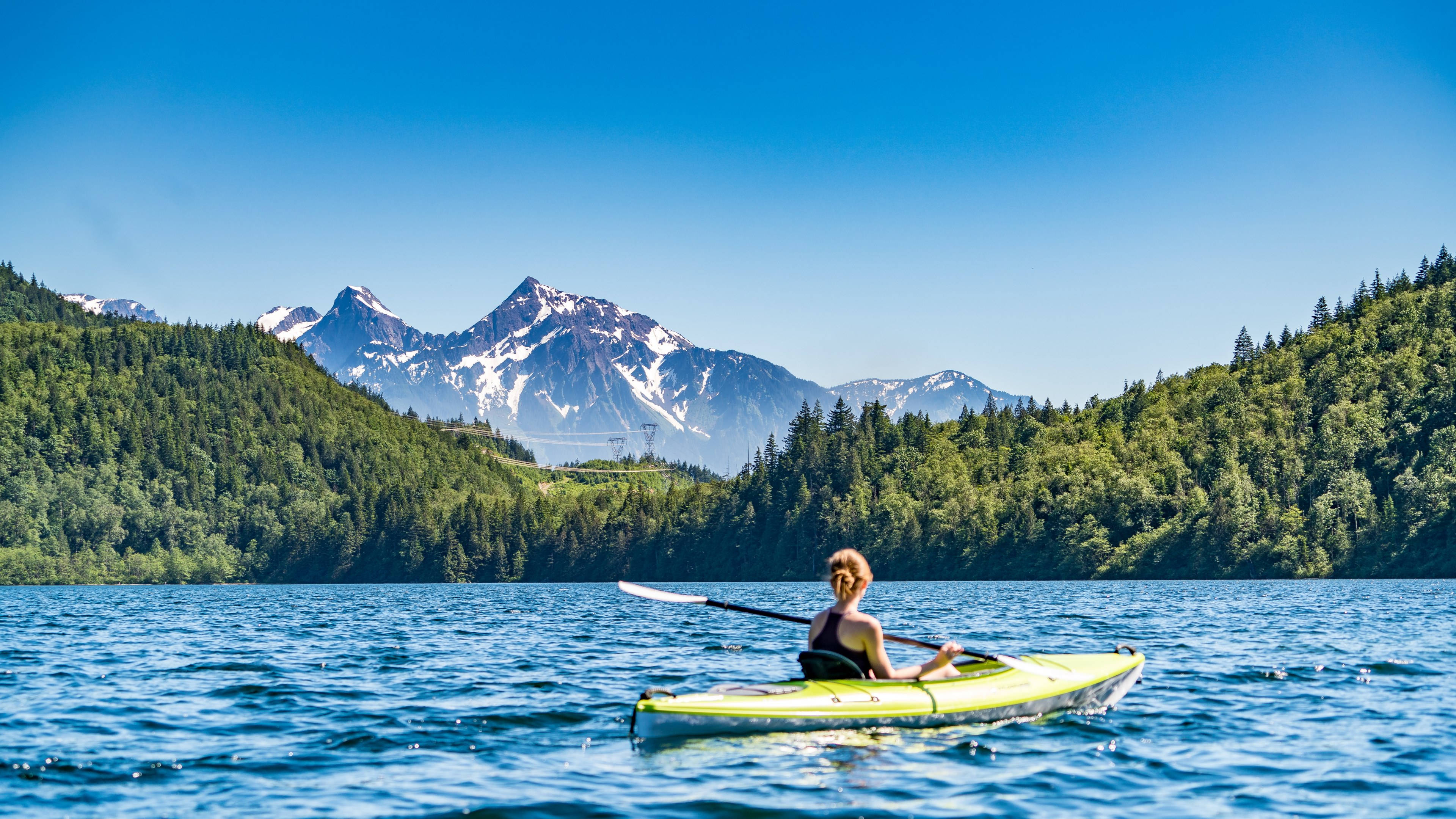 bright green kayak, calm blue lake, lush green forests, 4K Desktop Wallpaper