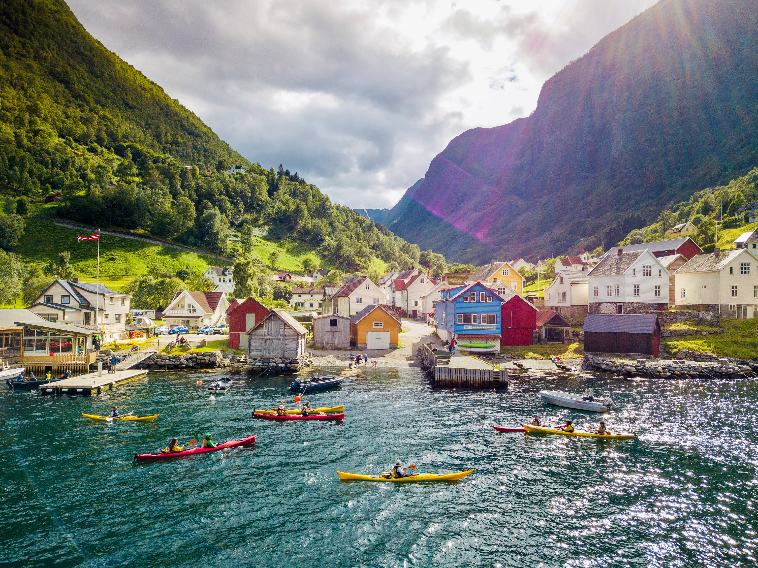 Friendly Town, fjord village, lush green mountains, 2K Desktop Wallpaper