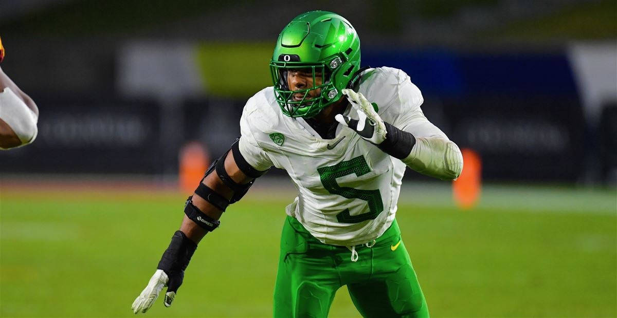 Kayvon Thibodeaux, green and white gear, stadium lights, SD Desktop Wallpaper